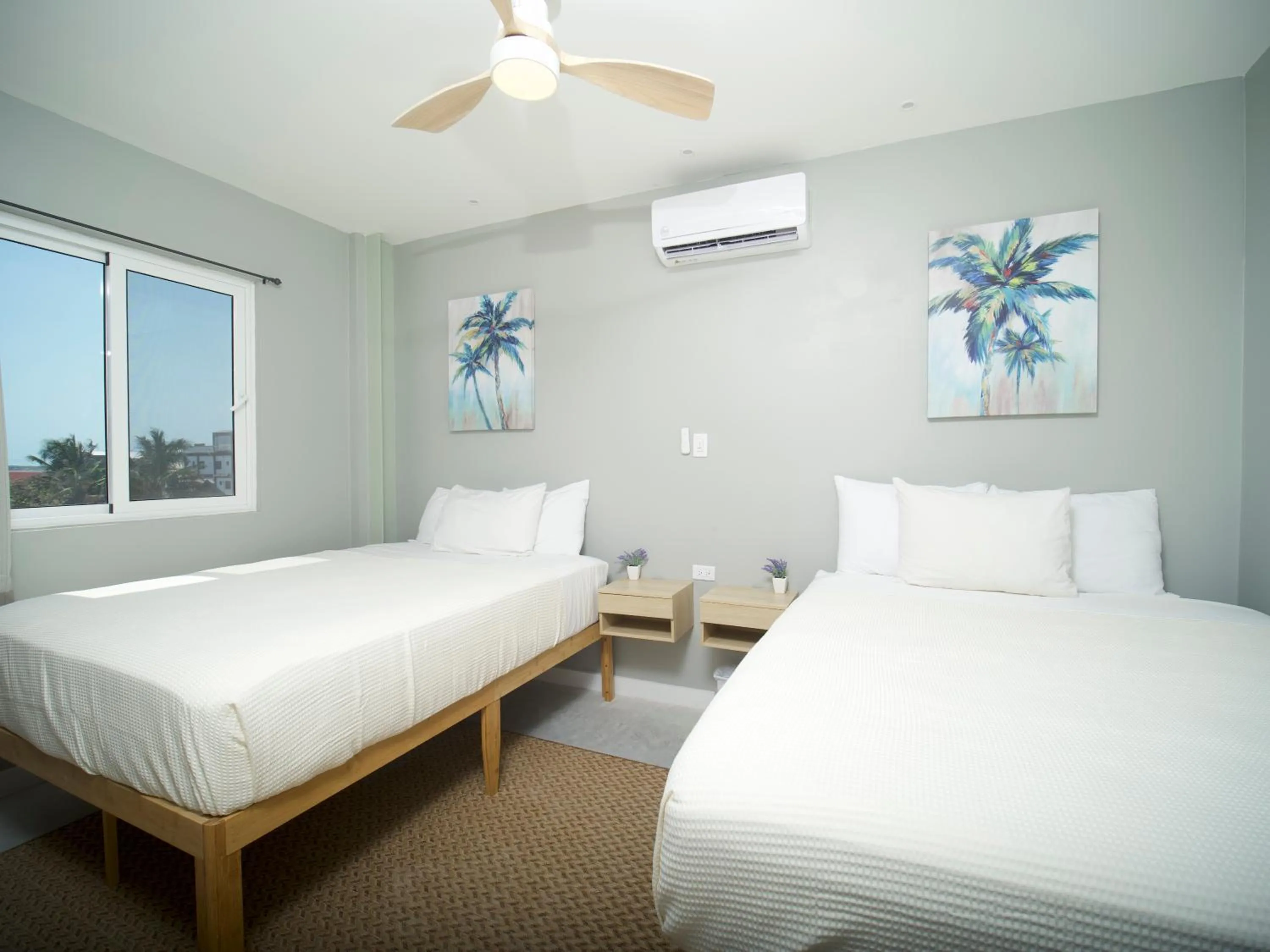 Photo of the whole room, Bed in Sandbar Beachfront Hotel & Hostel Restaurant