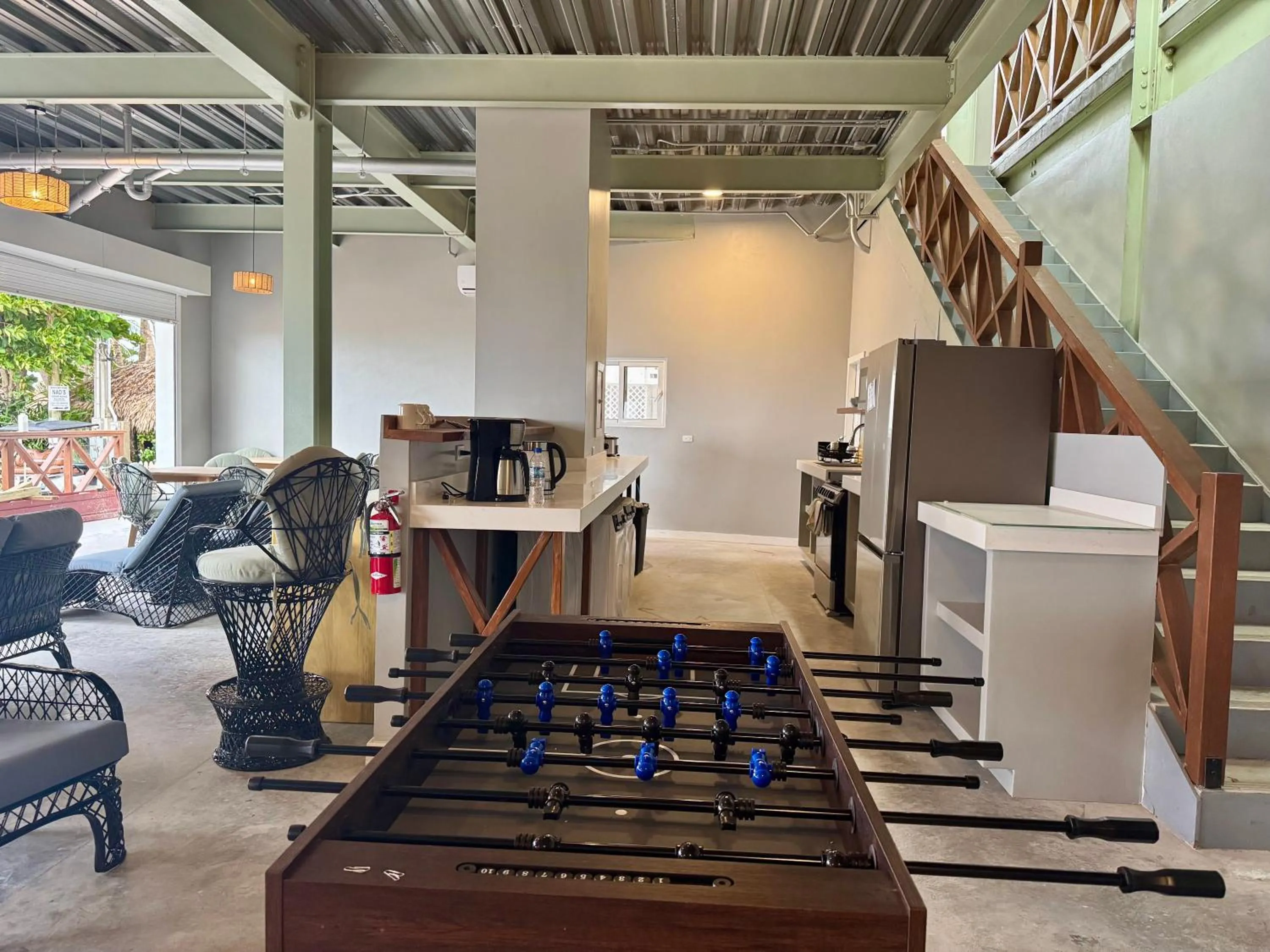 Communal lounge/ TV room in Sandbar Beachfront Hotel & Hostel Restaurant