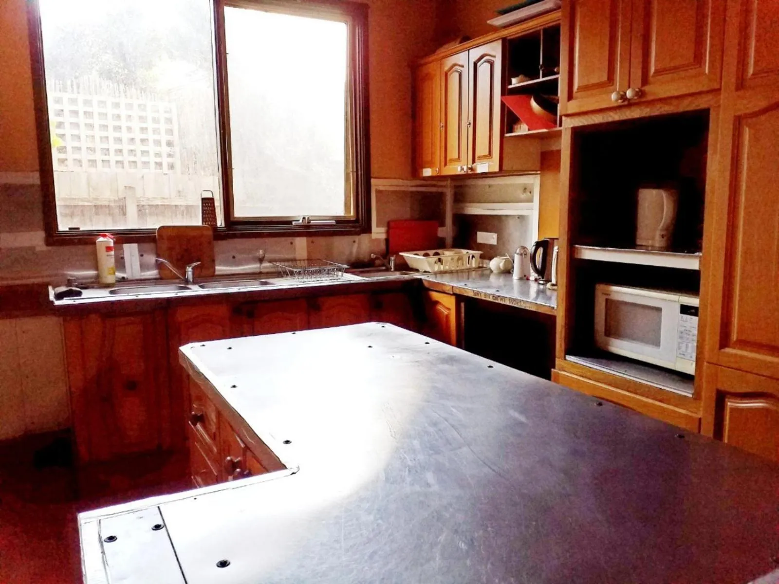 Communal kitchen in St Kilda East backpackers' hostel