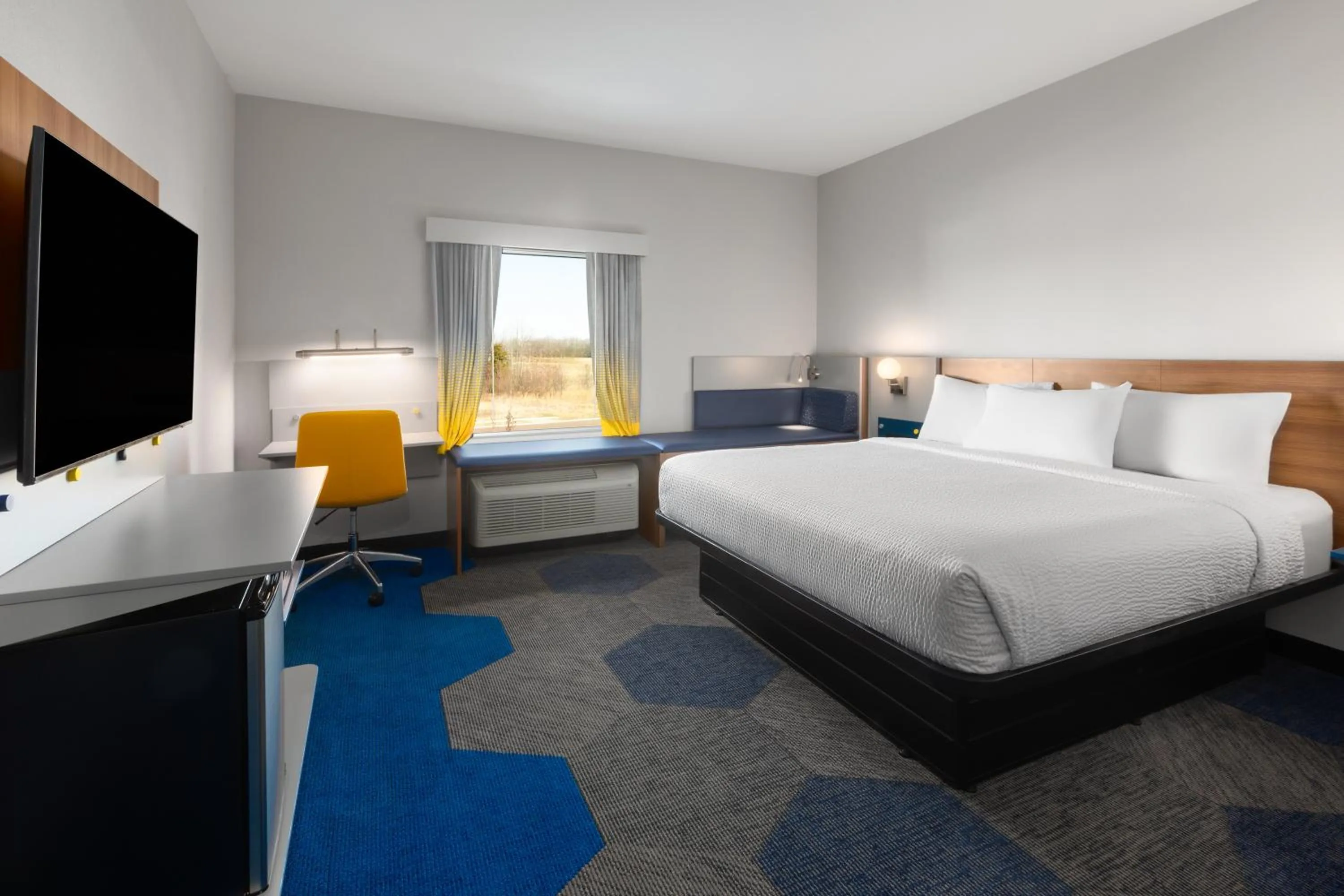Bed in Microtel Inn & Suites by Wyndham Olive Branch