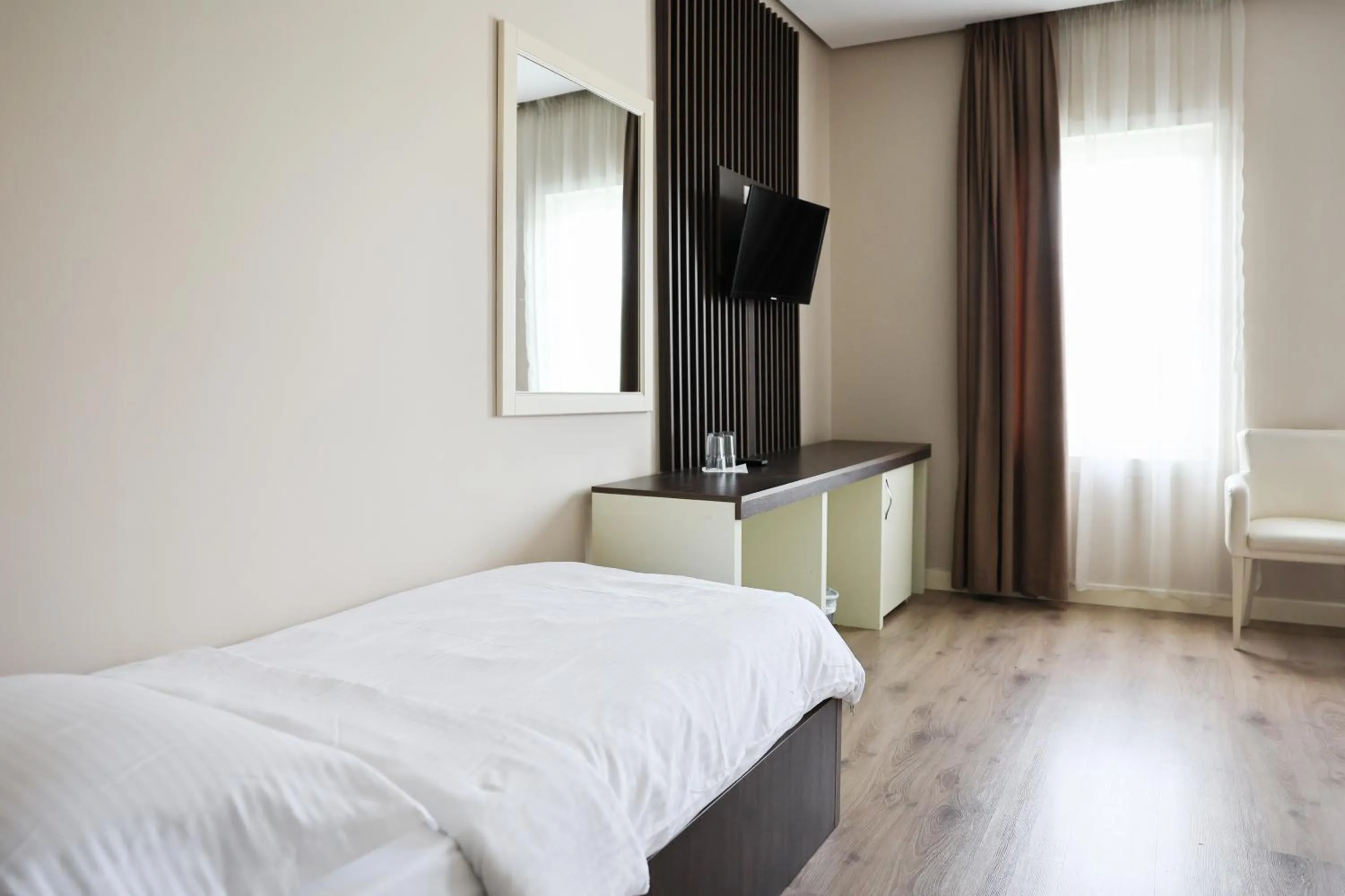 Bed in Gardenland Resort