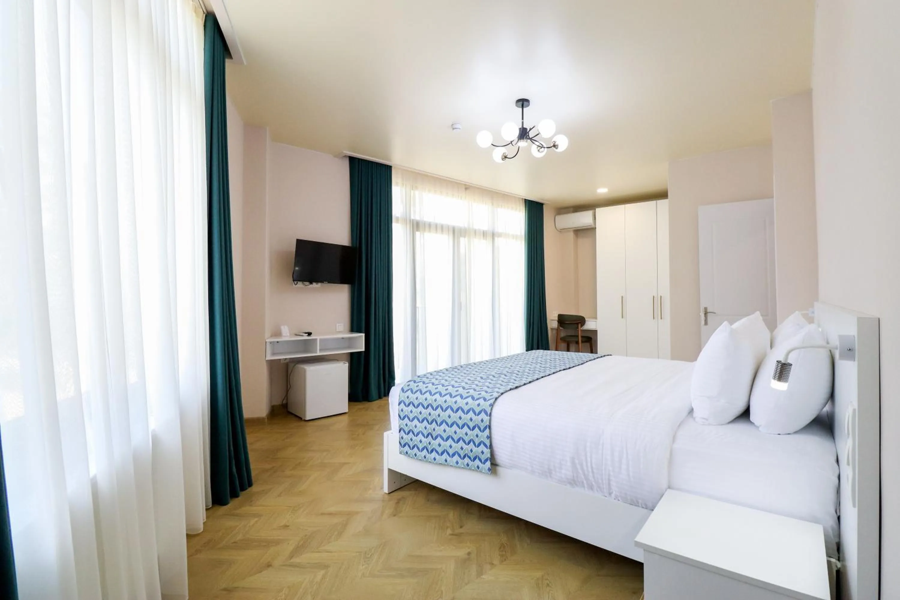 Bed in Emerald Borjomi Hotel