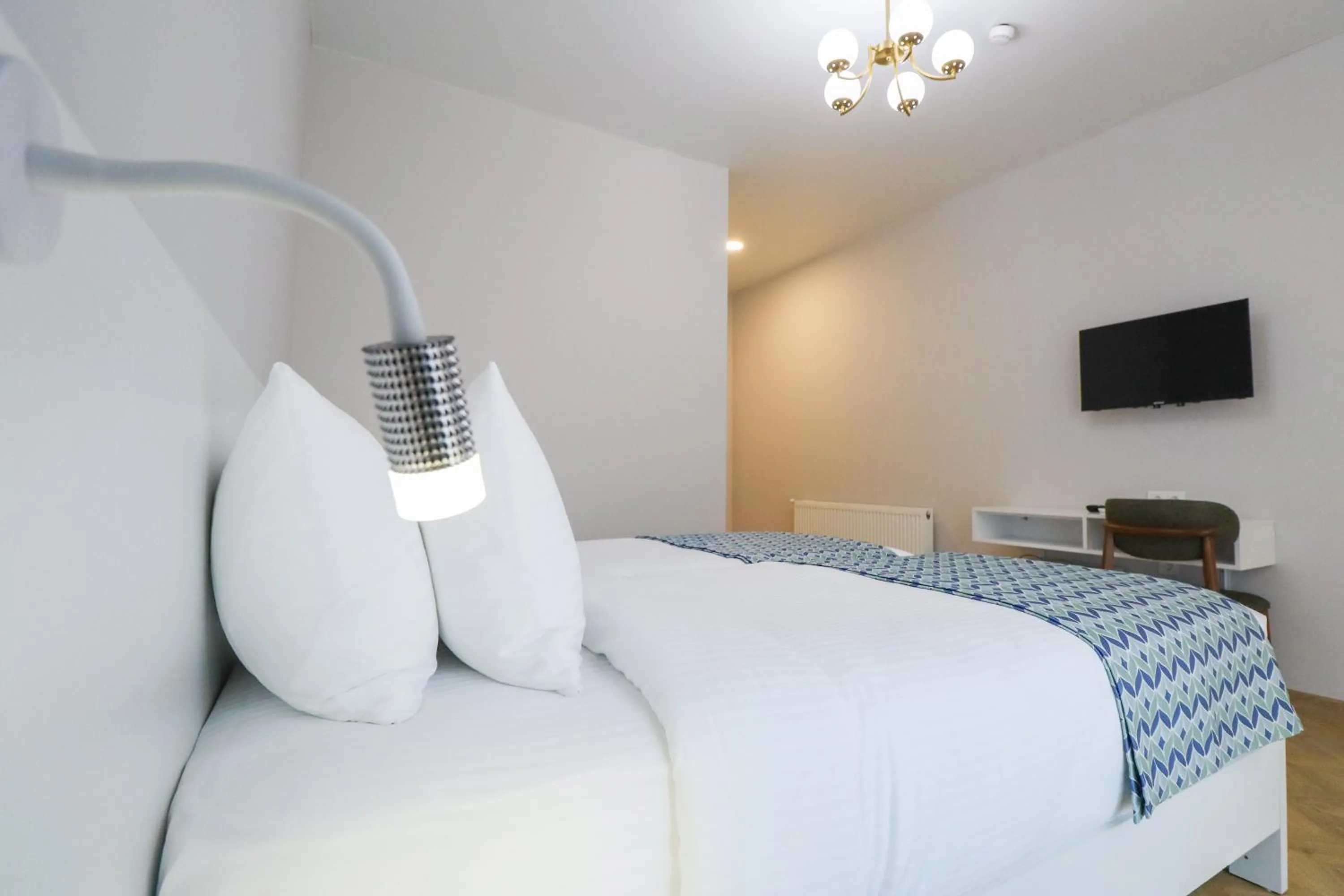 Bed in Emerald Borjomi Hotel