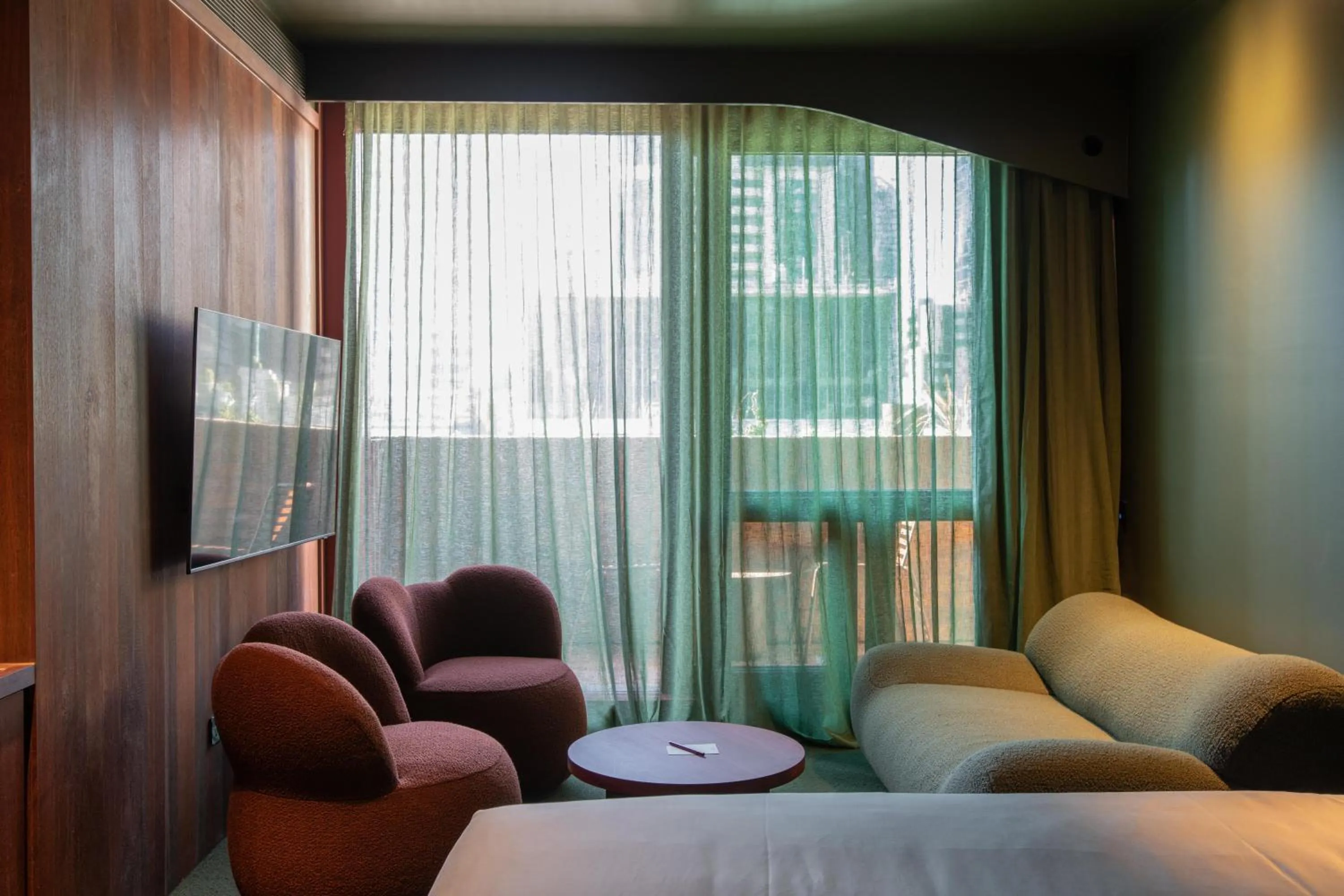 Seating area, Bed in Hyde Melbourne Place