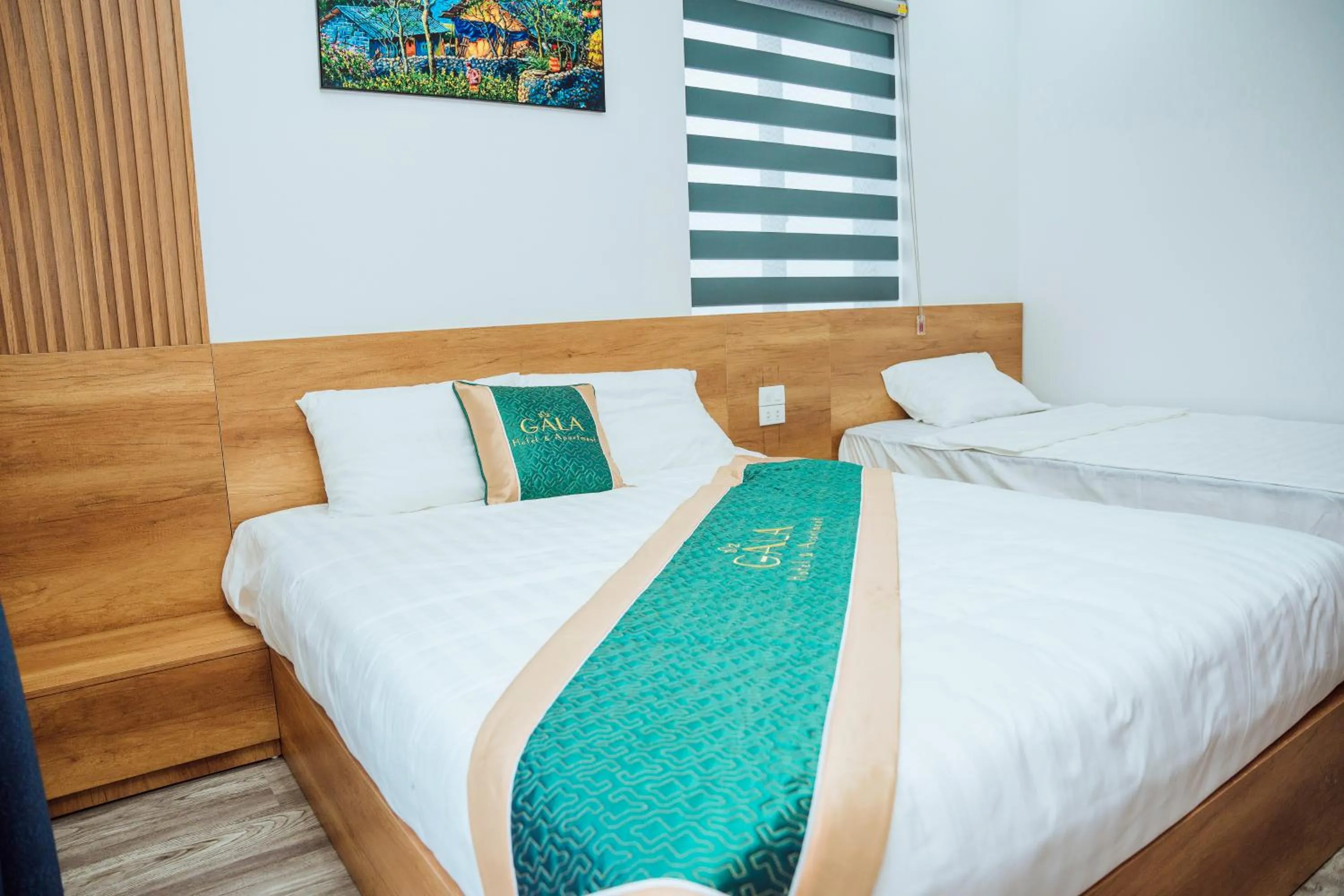 Bed in Gala Hotel & Apartment