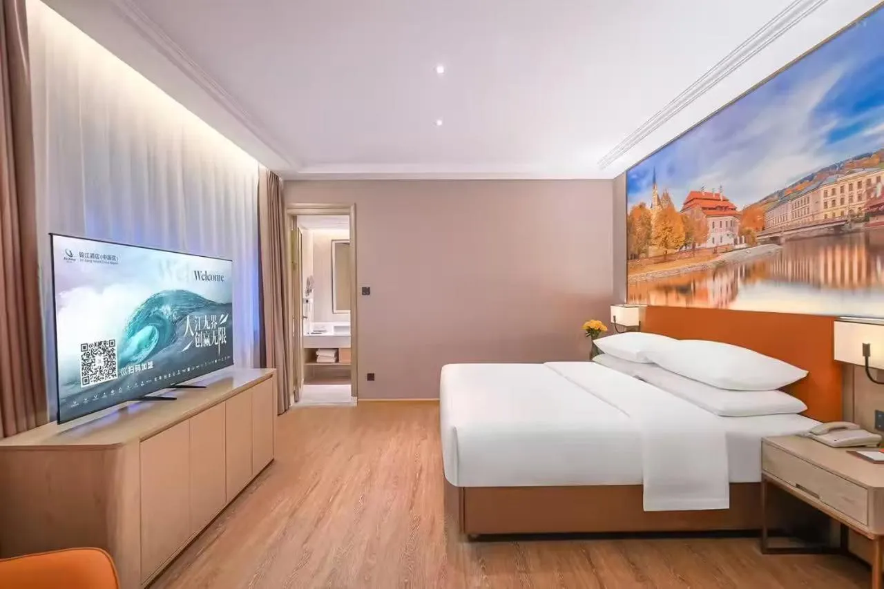 Bed in Vienna Hotel Jiangjin Wanda Plaza Shengquansi Subway Station