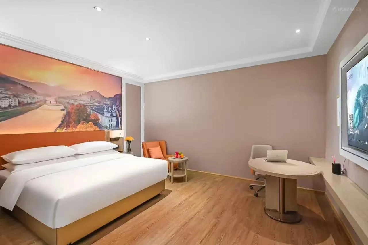 Bed in Vienna Hotel Jiangjin Wanda Plaza Shengquansi Subway Station