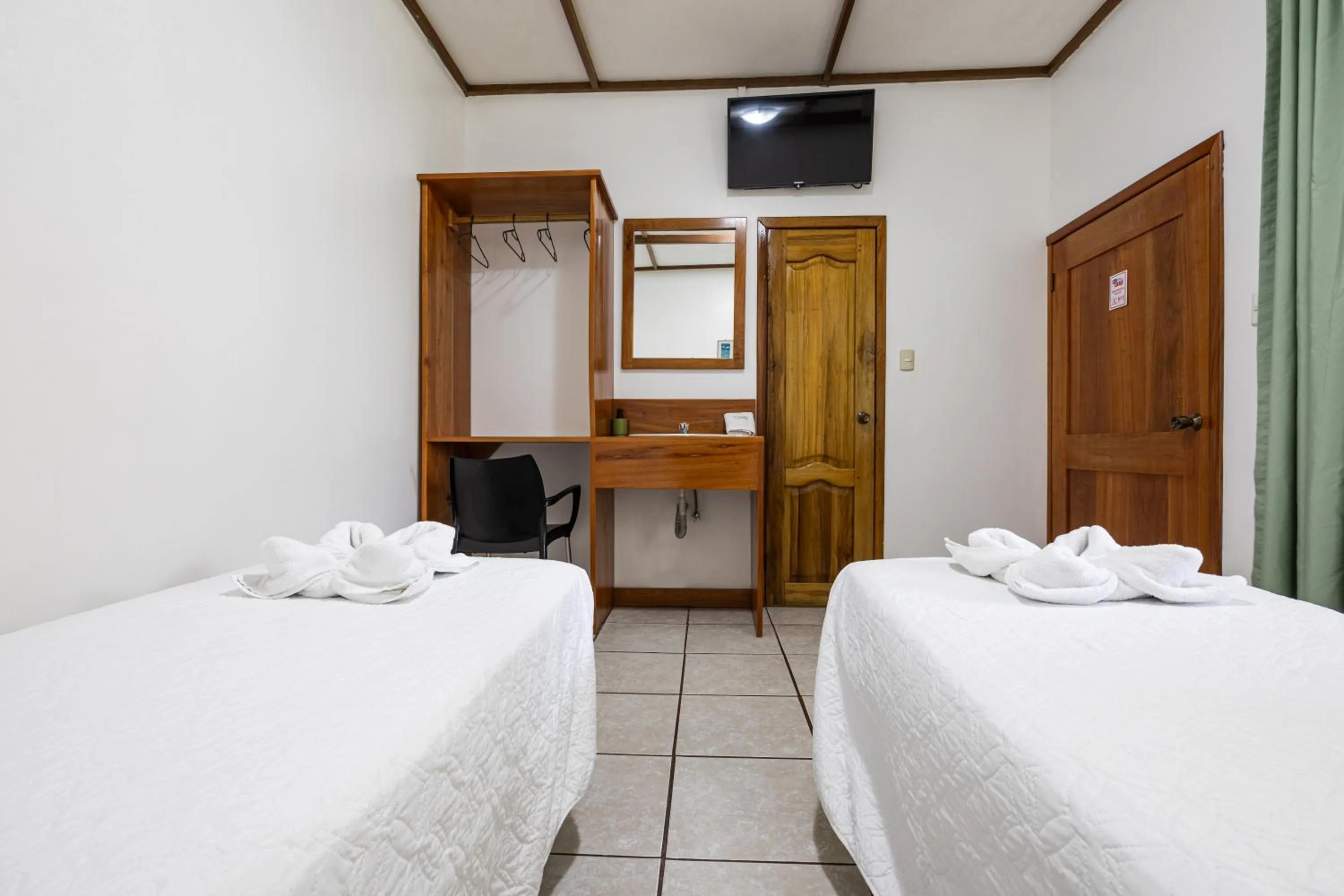 Bed in La Peregrina Galapagos B&B