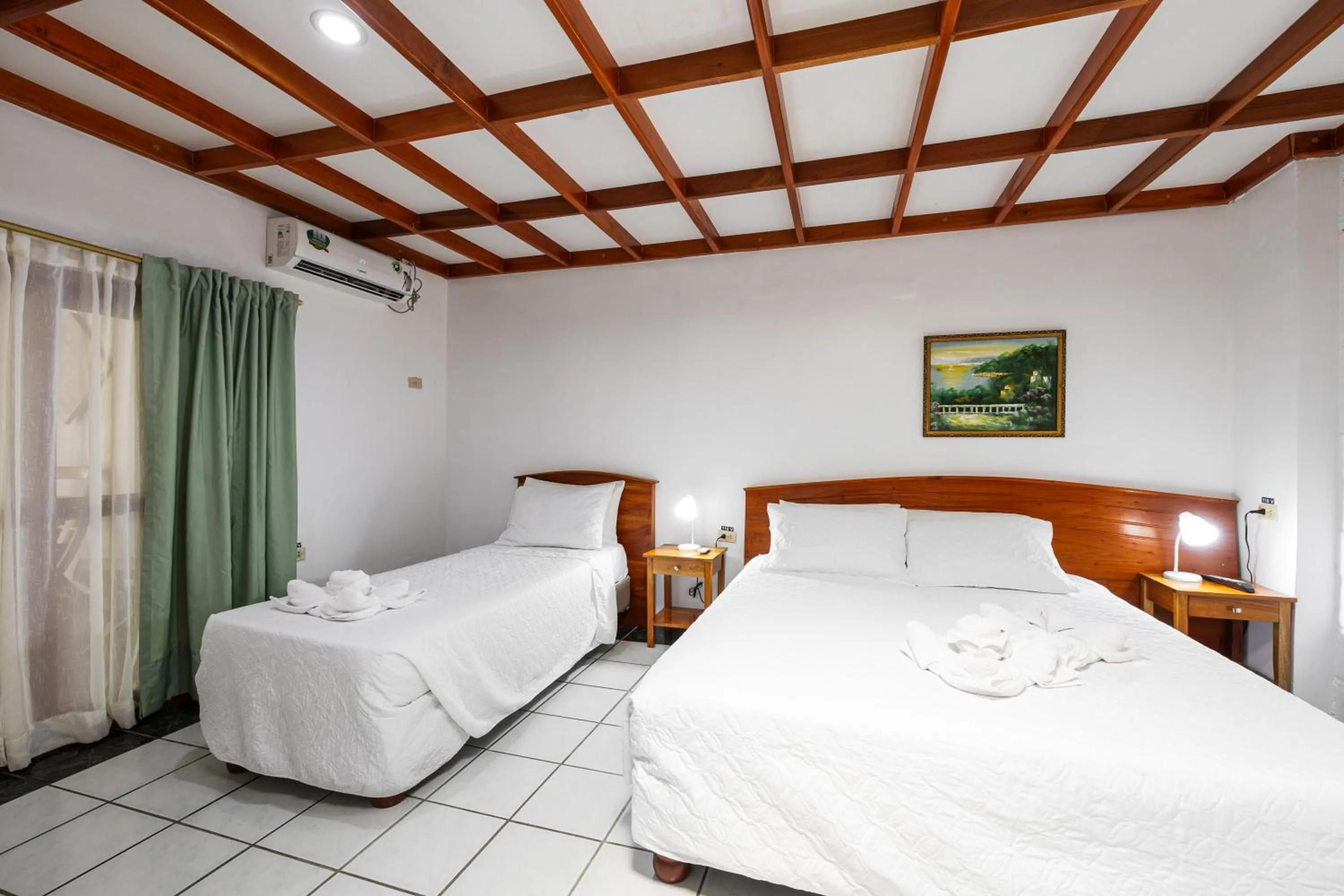 Bed in La Peregrina Galapagos B&B