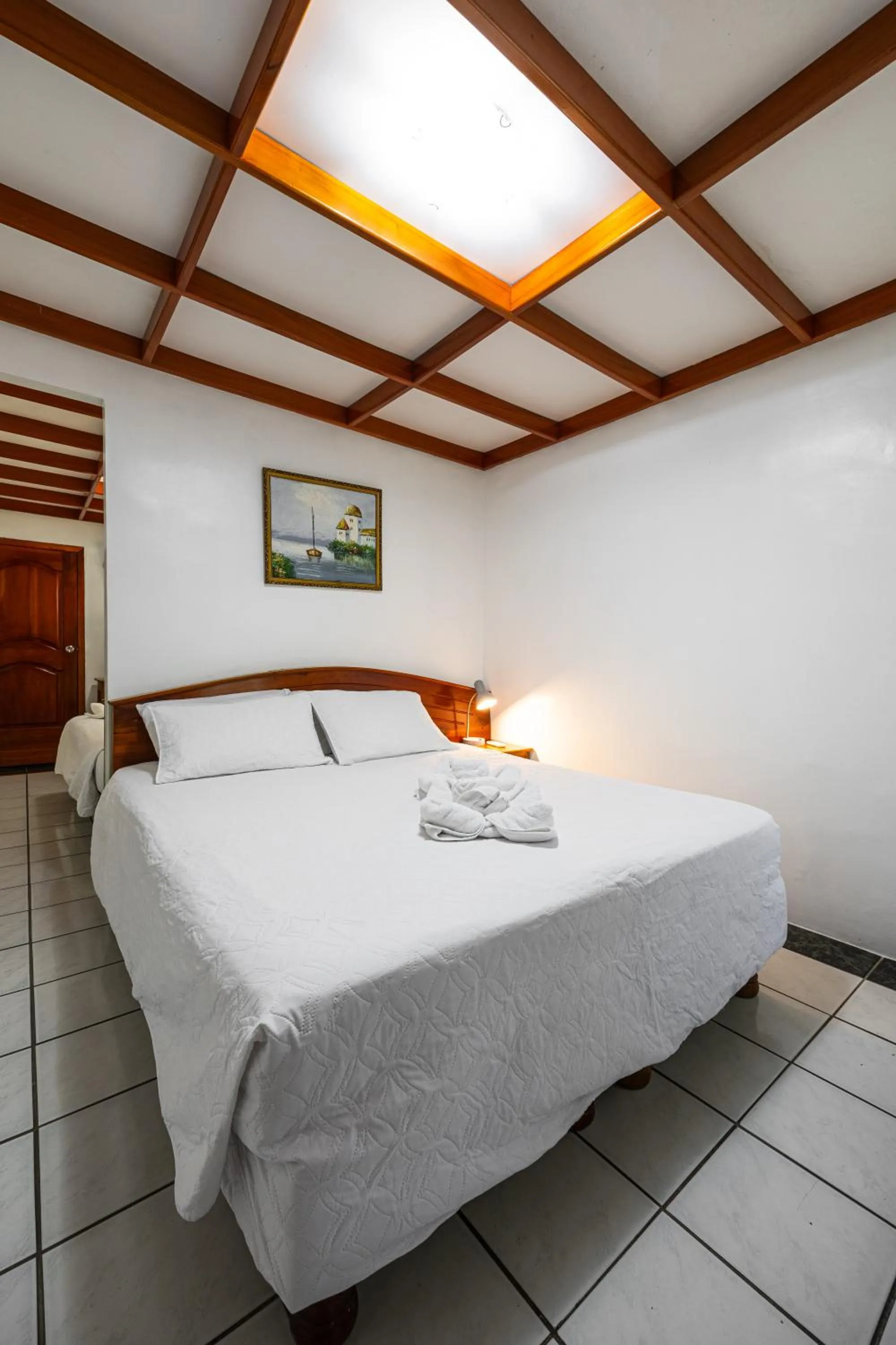 Bed in La Peregrina Galapagos B&B