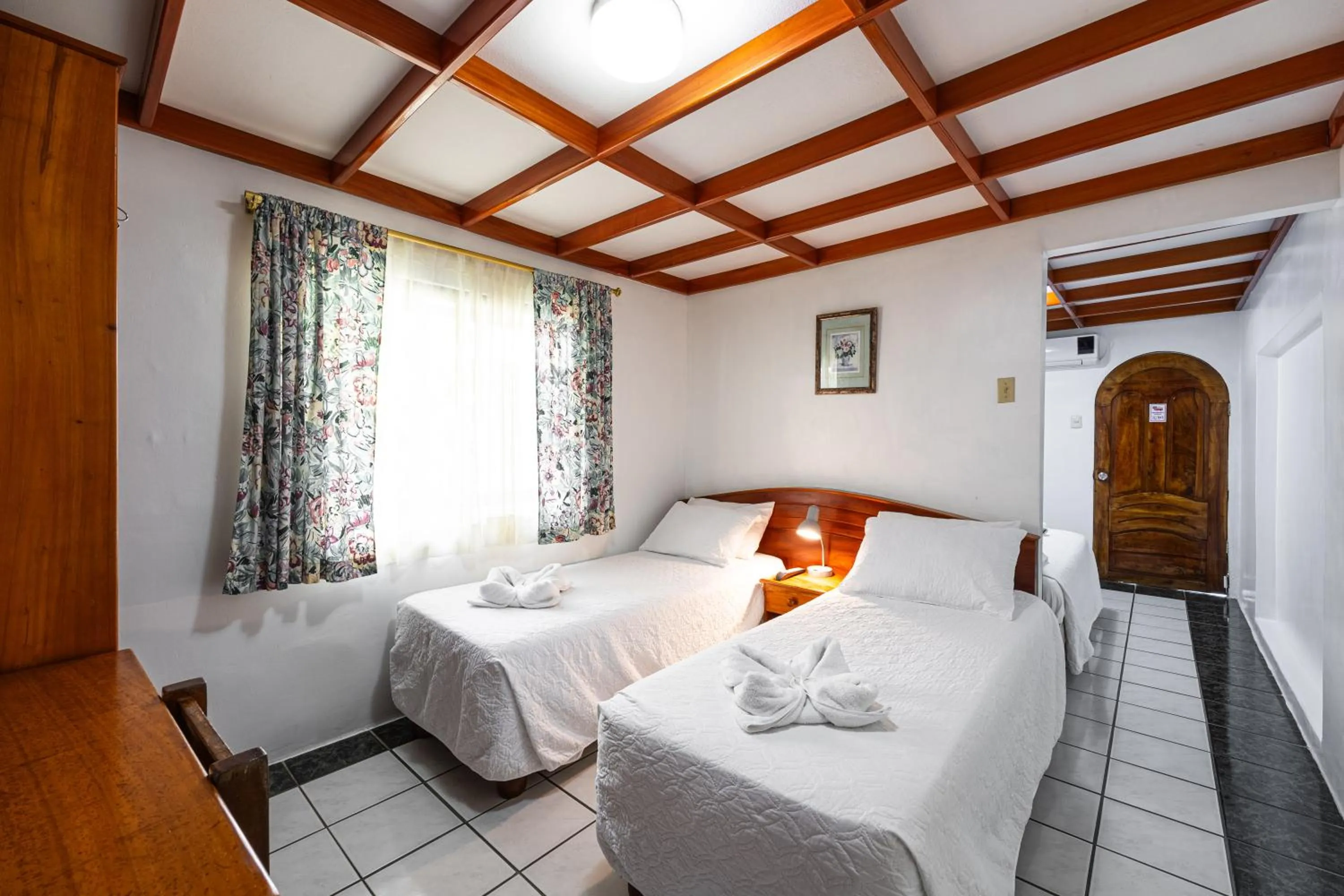 Bed in La Peregrina Galapagos B&B