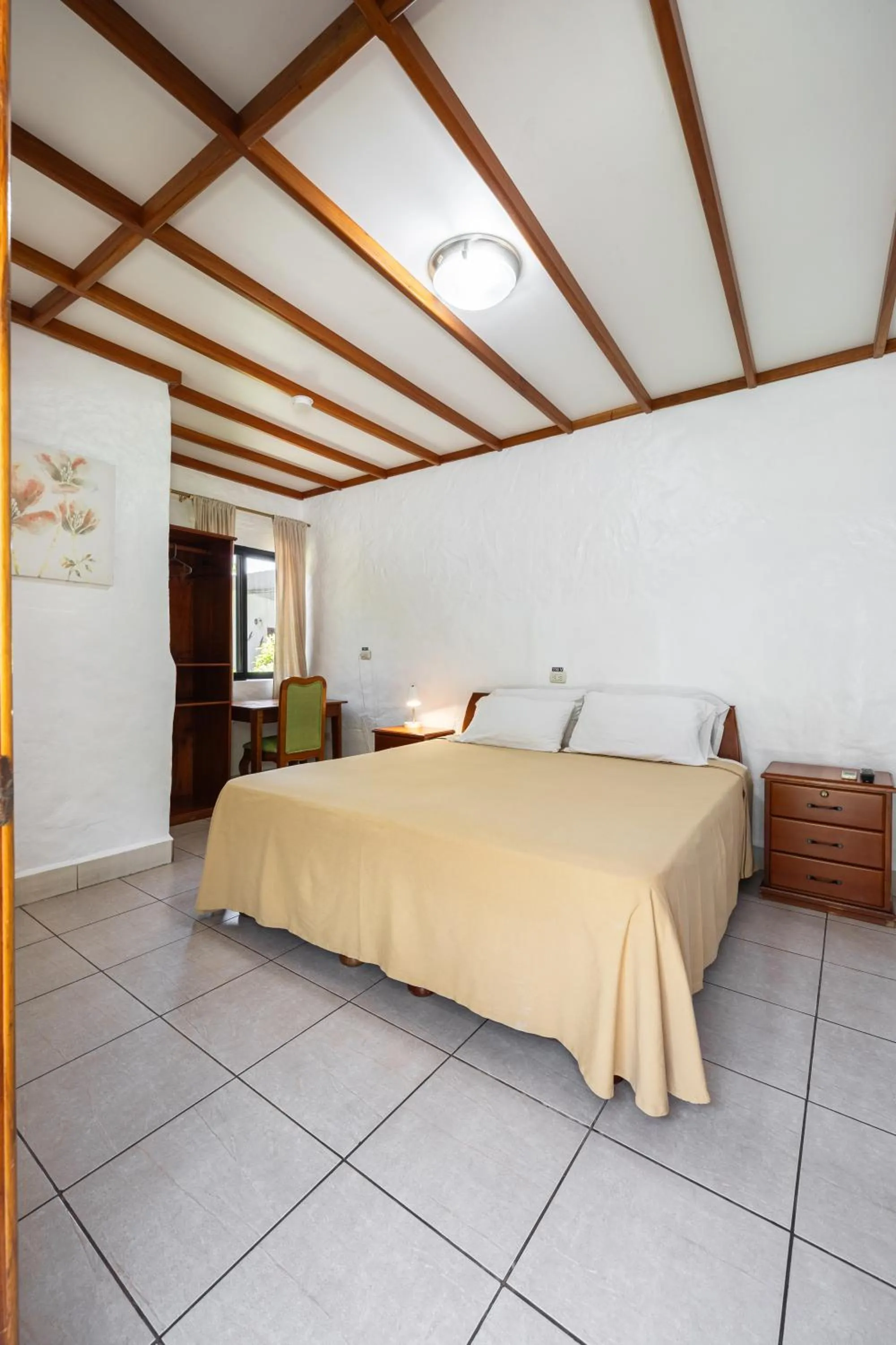 Bed in La Peregrina Galapagos B&B