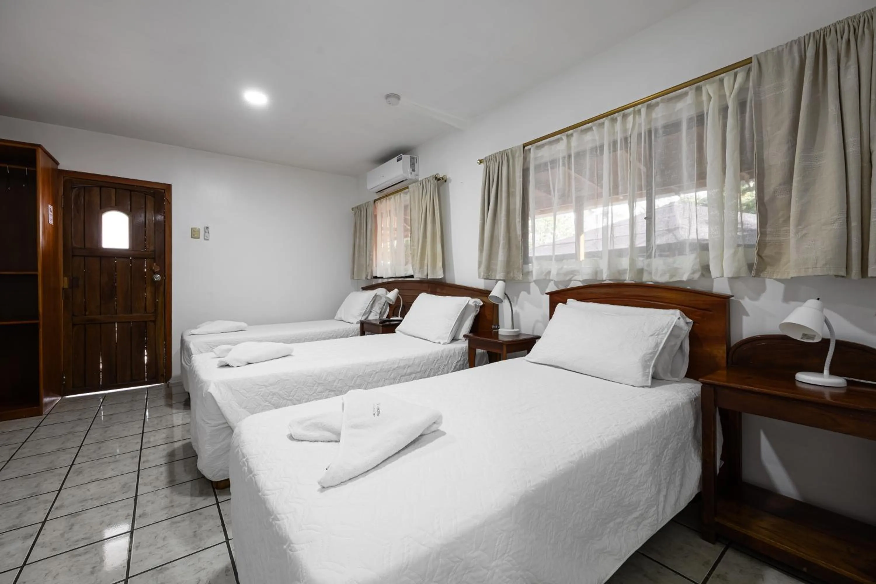 Bed in La Peregrina Galapagos B&B