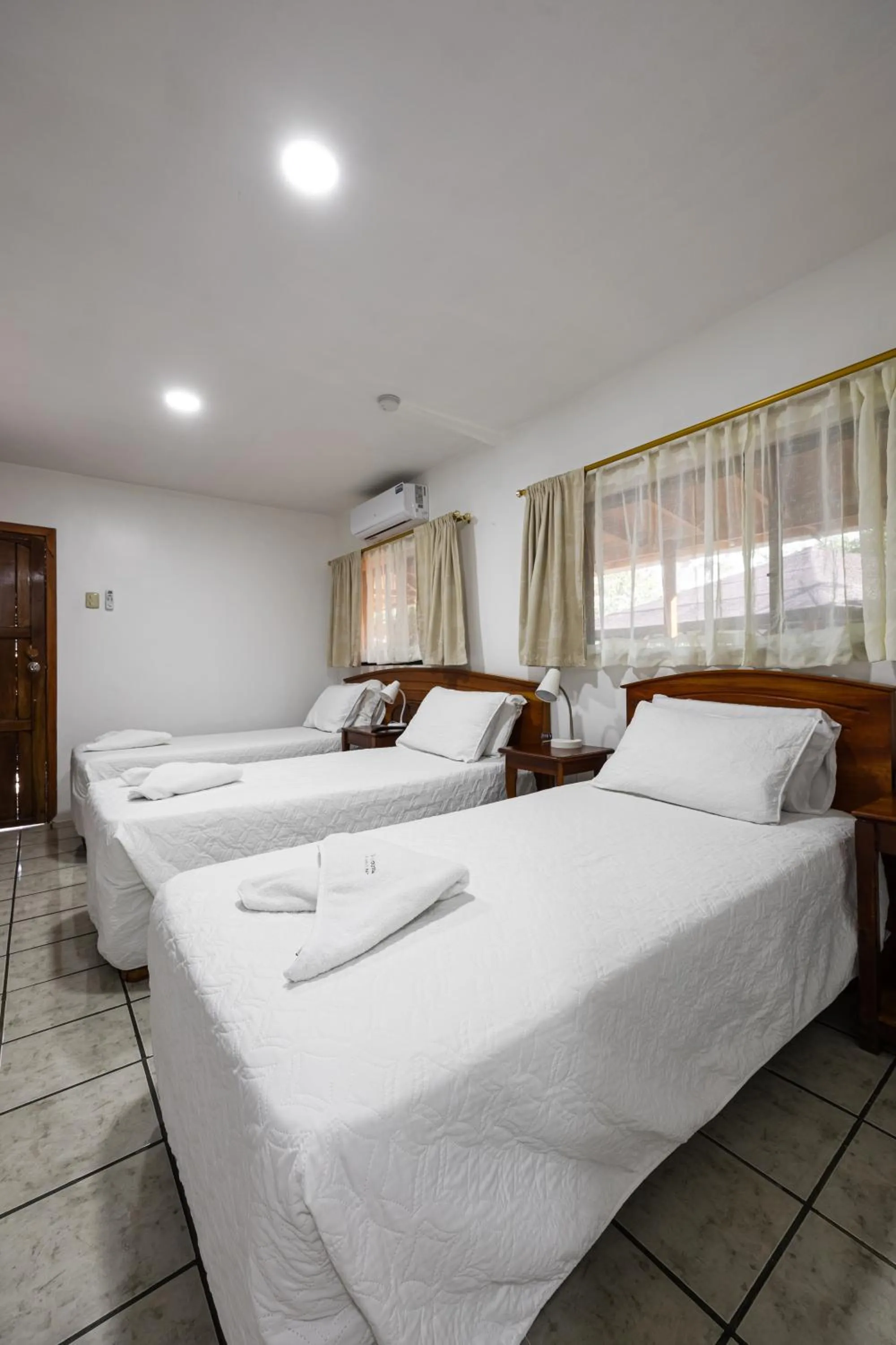 Bed in La Peregrina Galapagos B&B