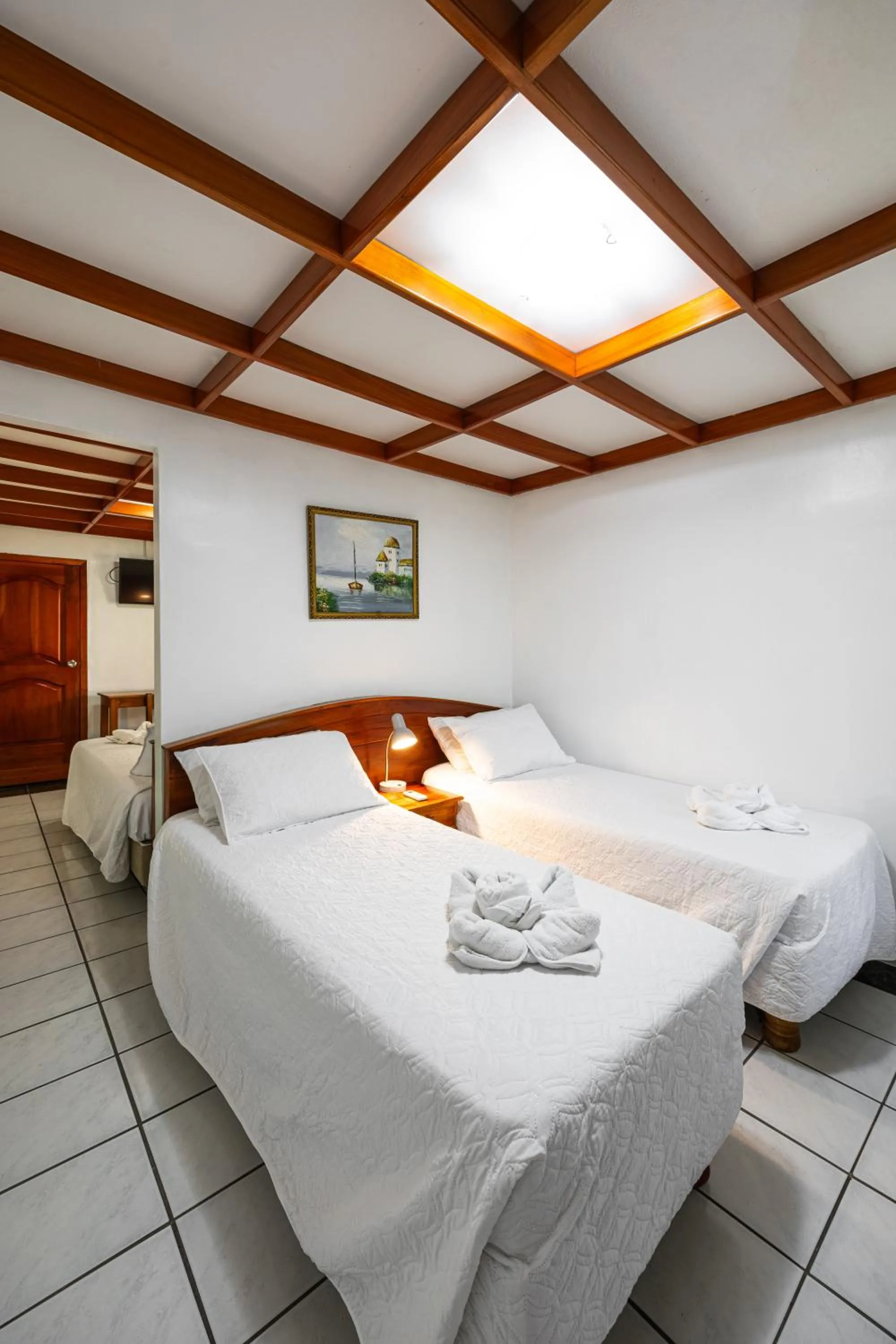 Bed in La Peregrina Galapagos B&B