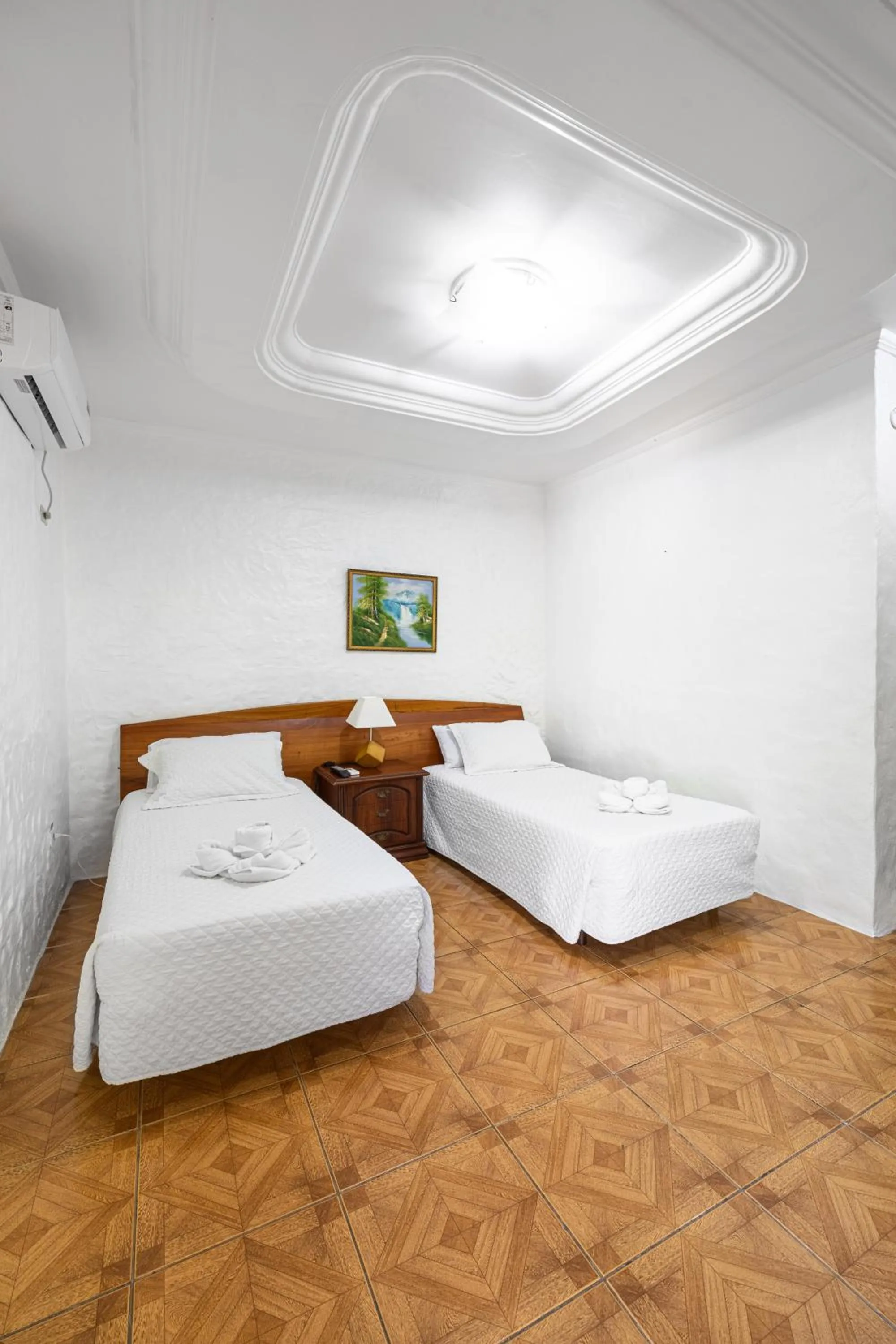 Bed in La Peregrina Galapagos B&B