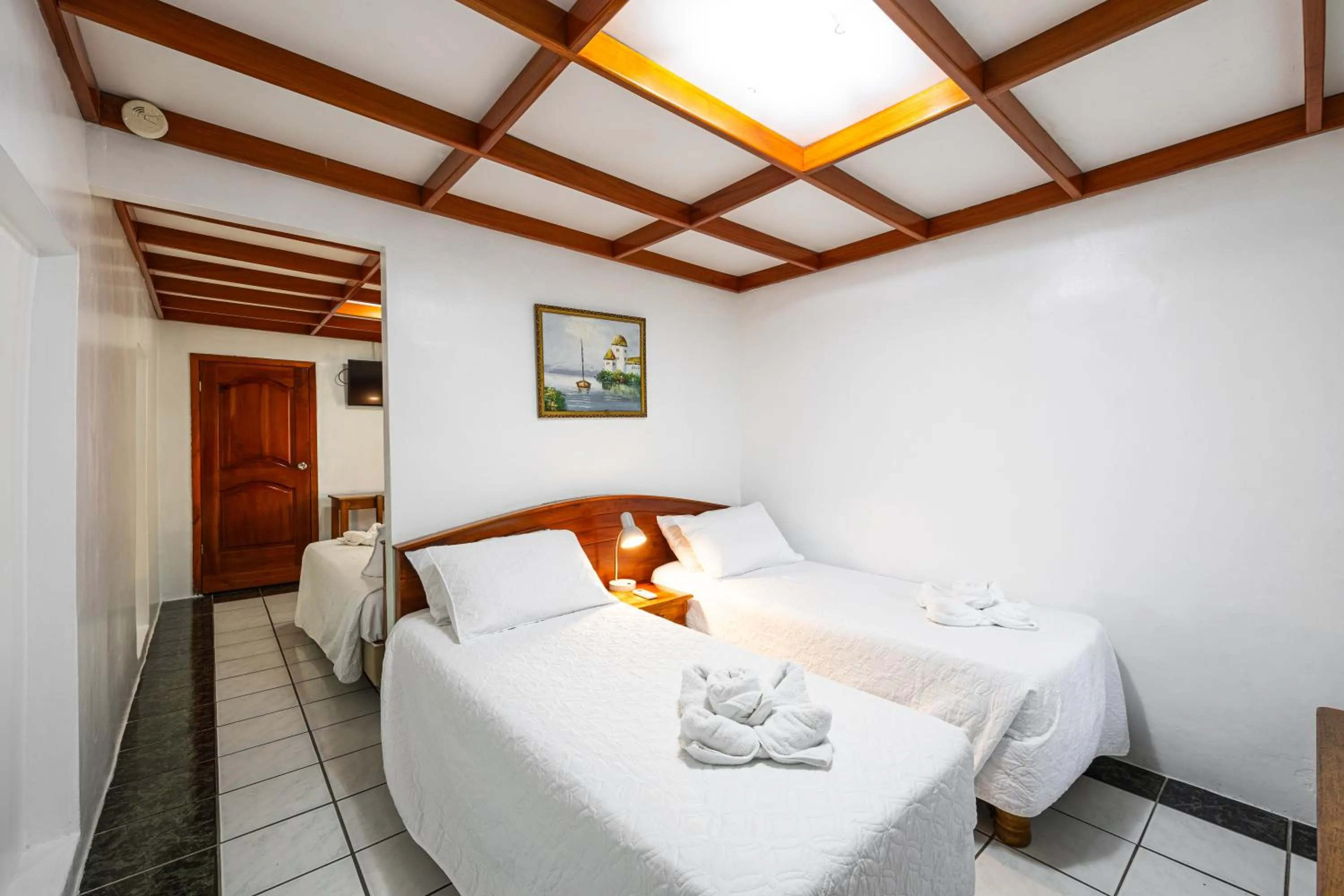 Bed in La Peregrina Galapagos B&B