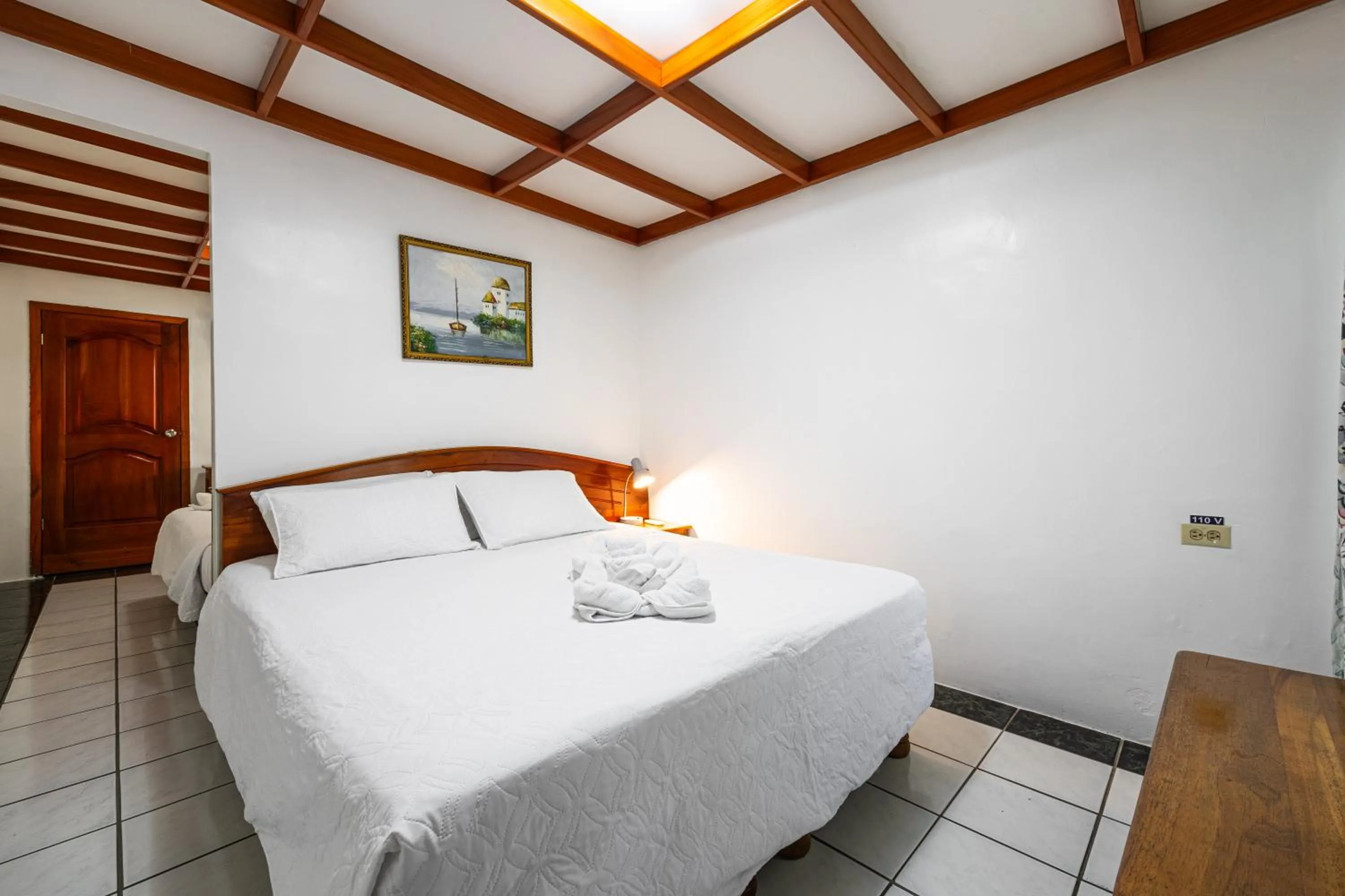 Bed in La Peregrina Galapagos B&B