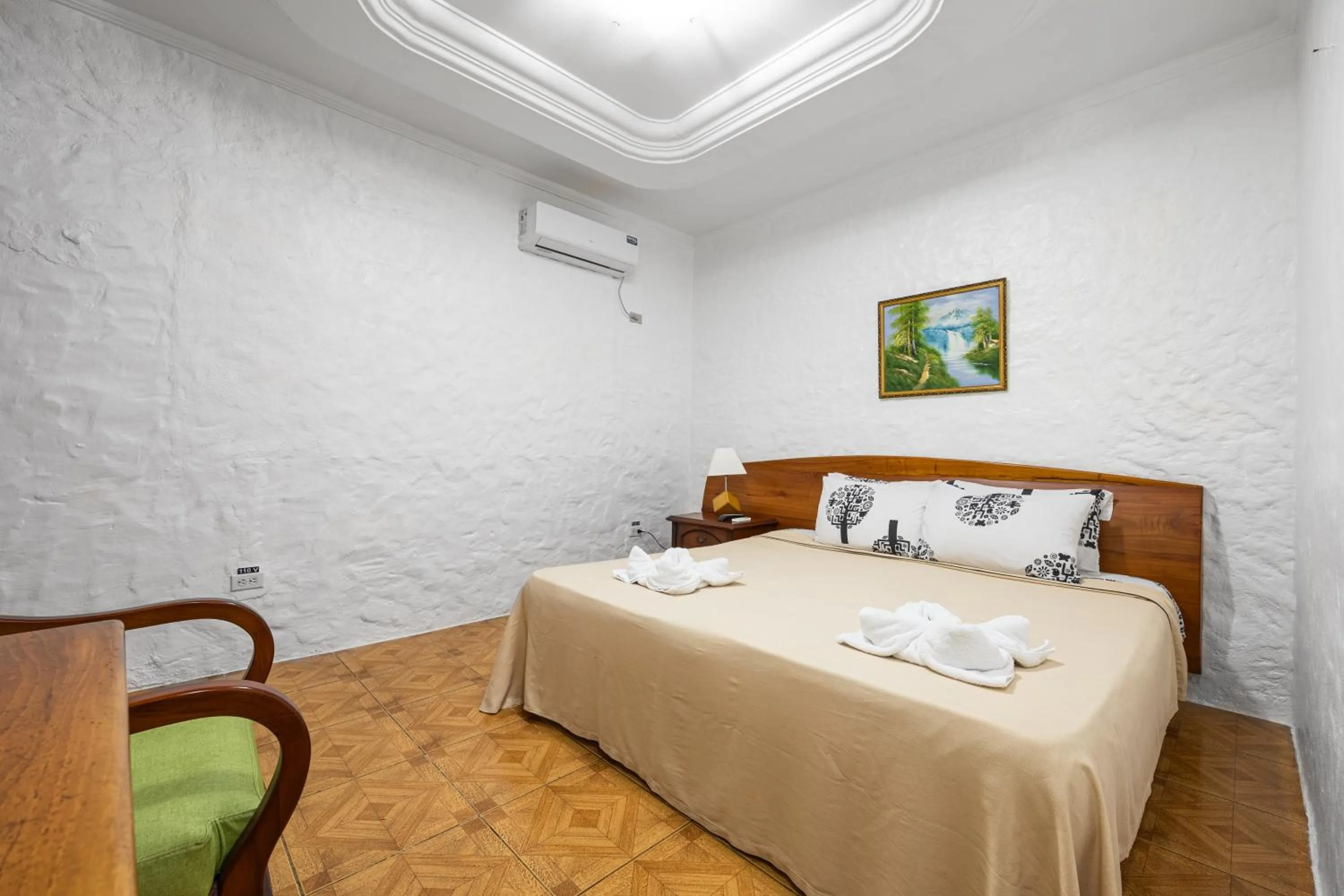 Bed in La Peregrina Galapagos B&B