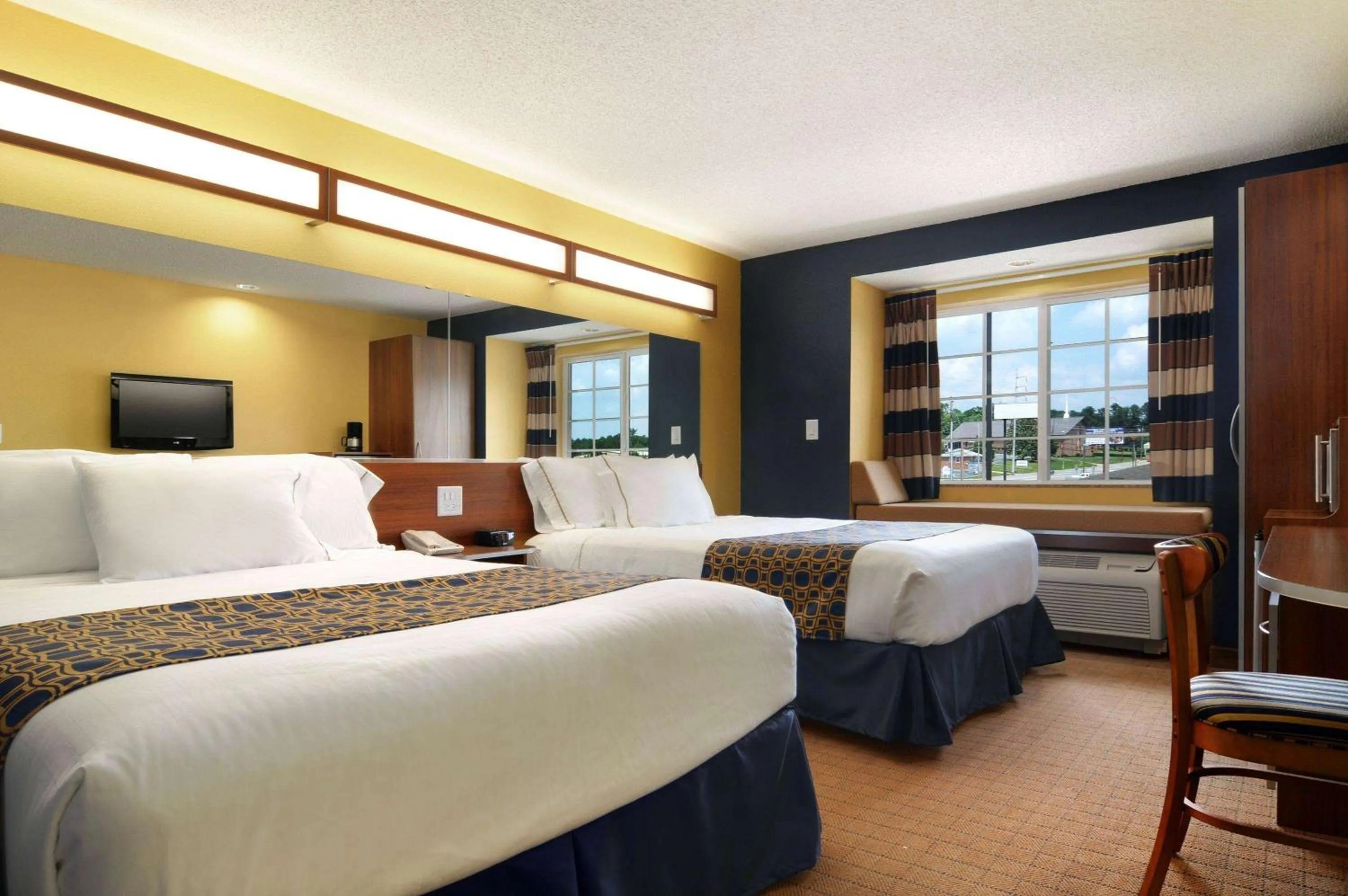 Photo of the whole room, Bed in Microtel Inn & Suites by Wyndham Columbus Near Fort Moore