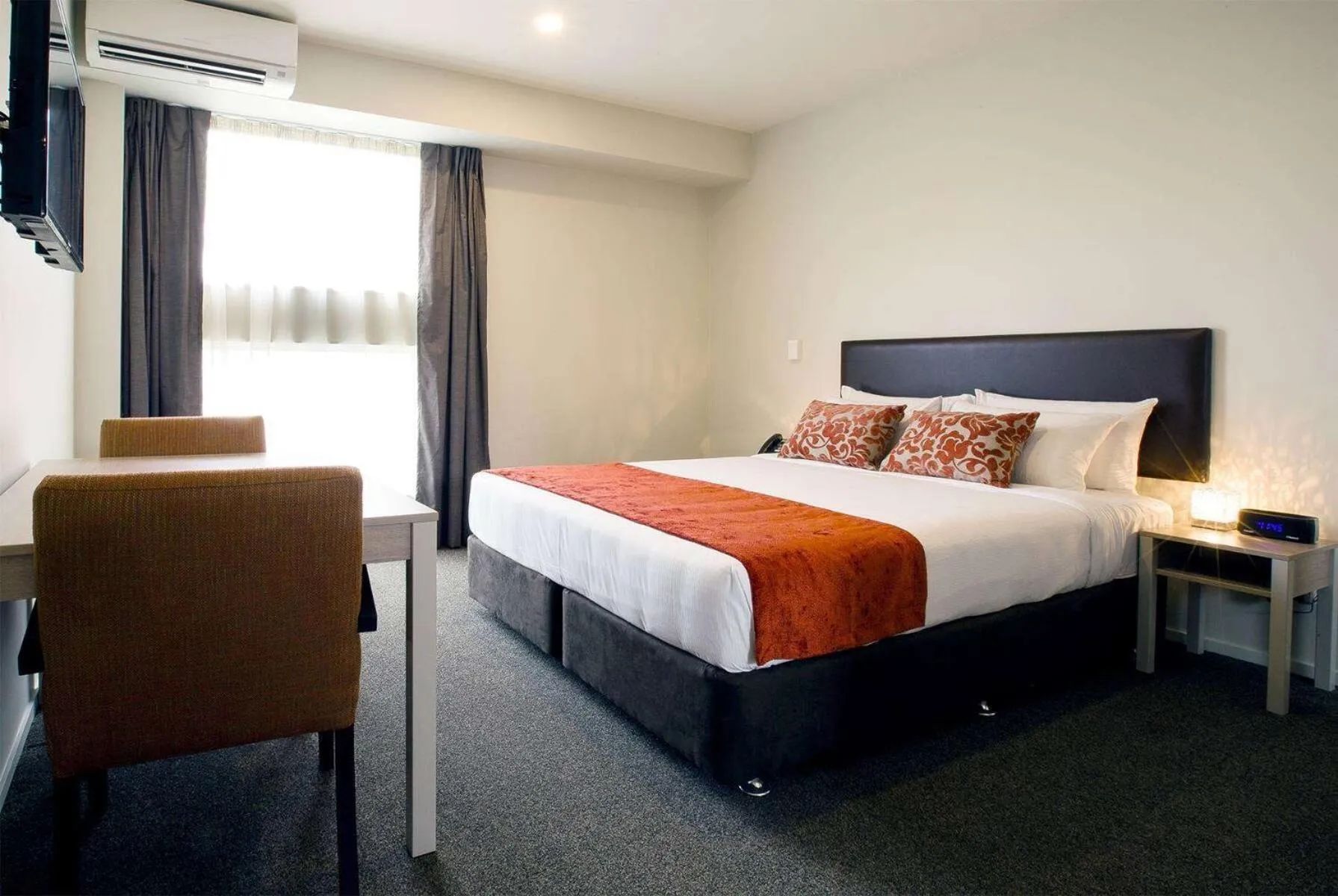 Photo of the whole room, Bed in Ramada Suites by Wyndham Christchurch City