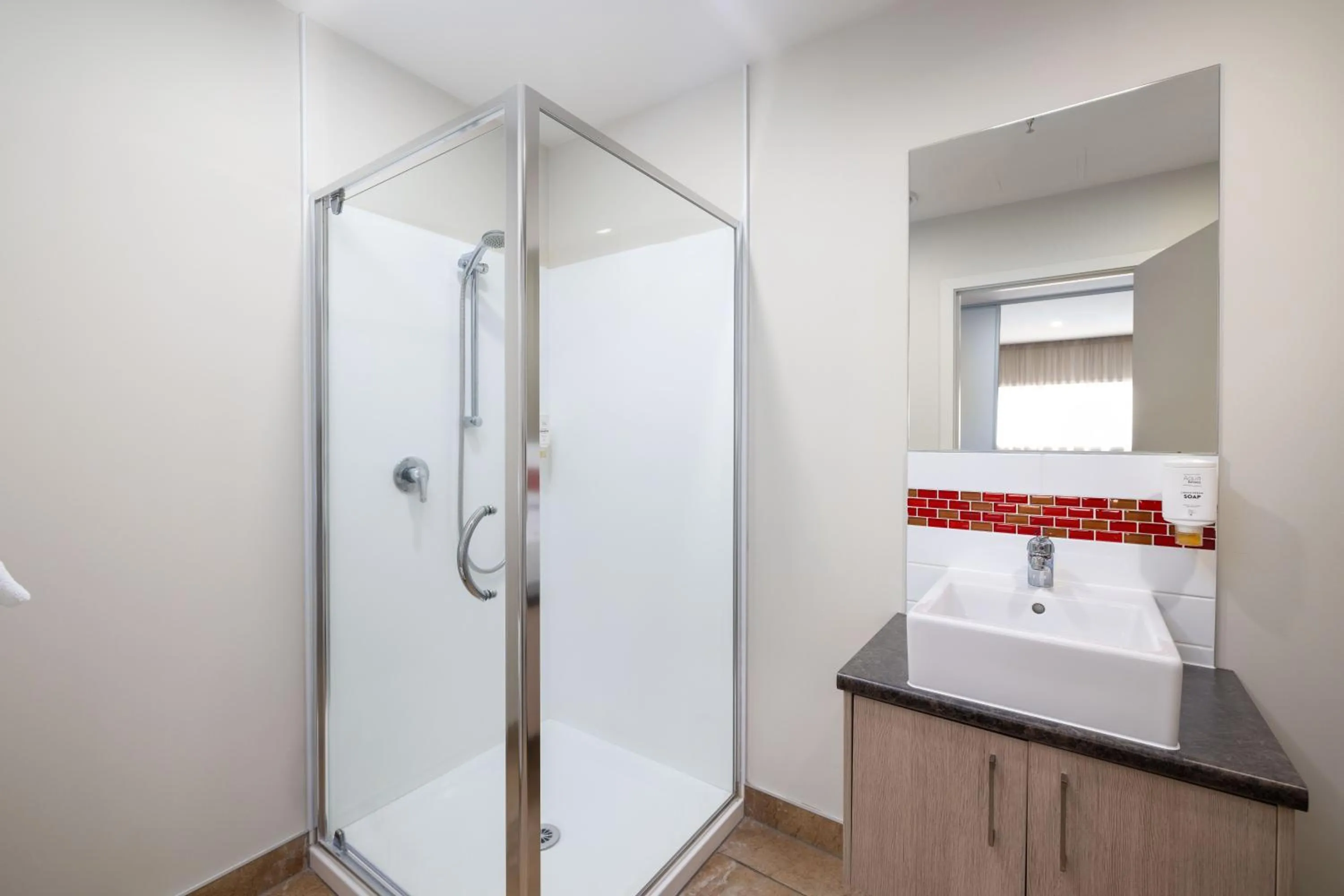 Shower in Ramada Suites by Wyndham Christchurch City