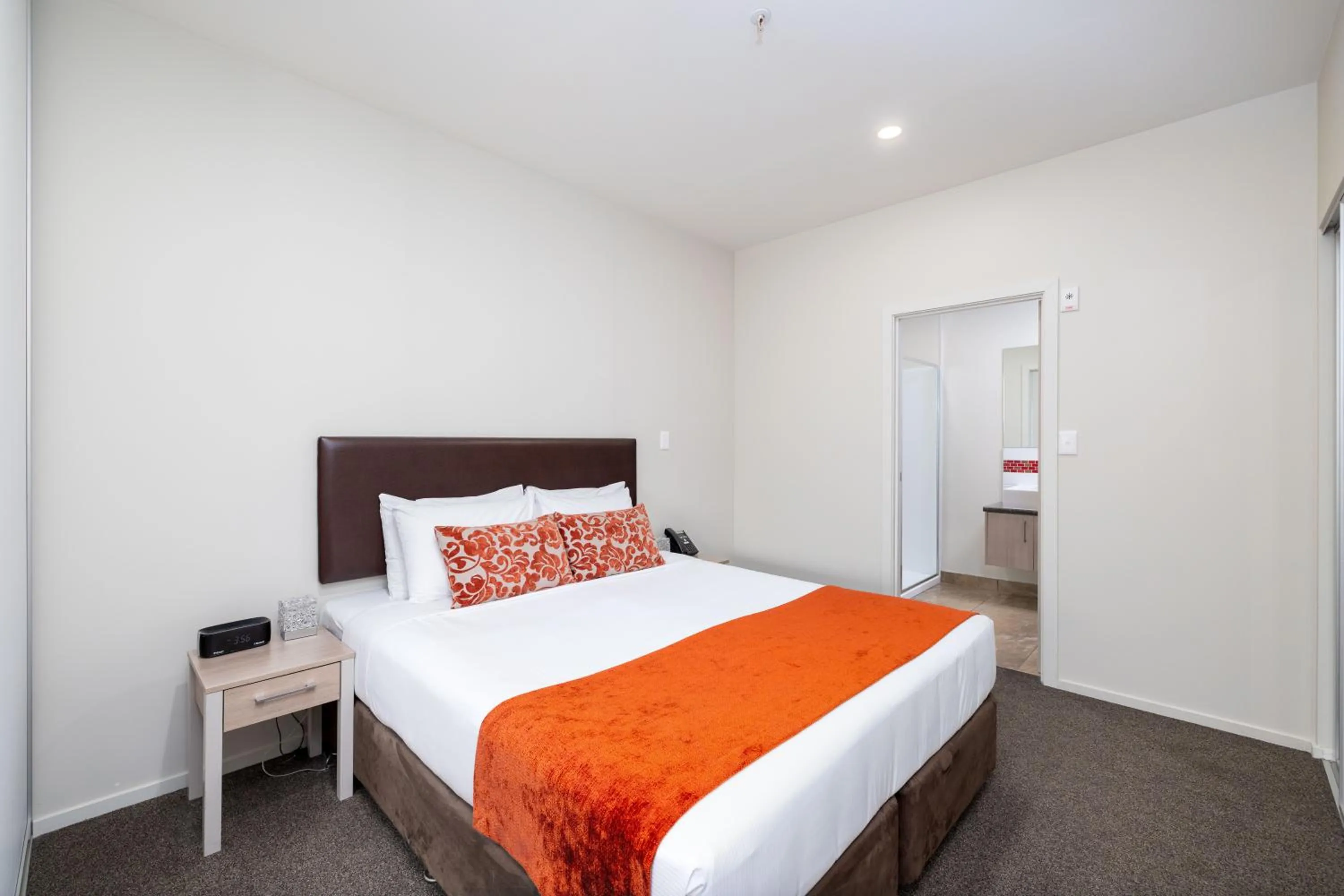 Bed in Ramada Suites by Wyndham Christchurch City