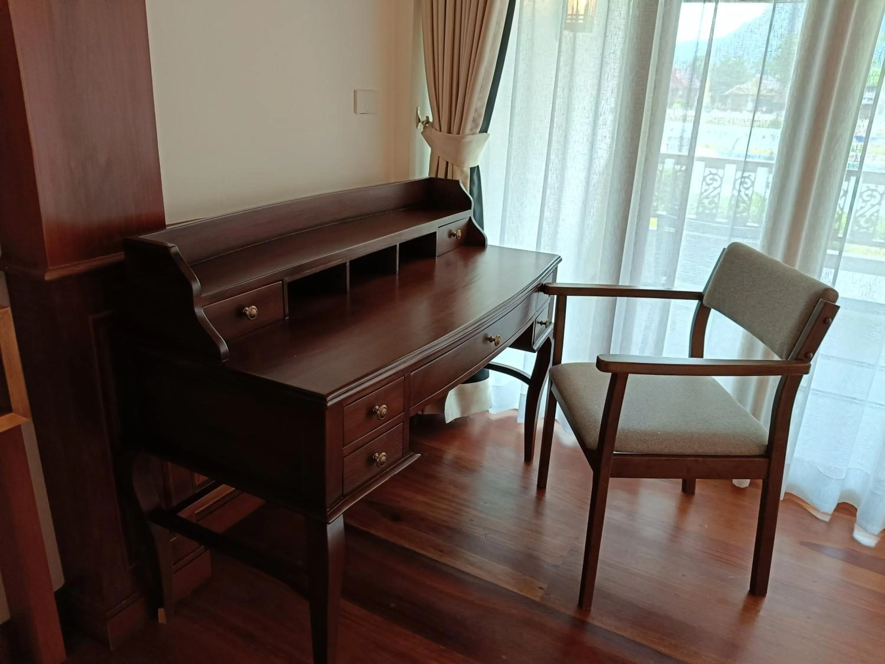 Seating area in Phubarn VimarnVangvieng Resort