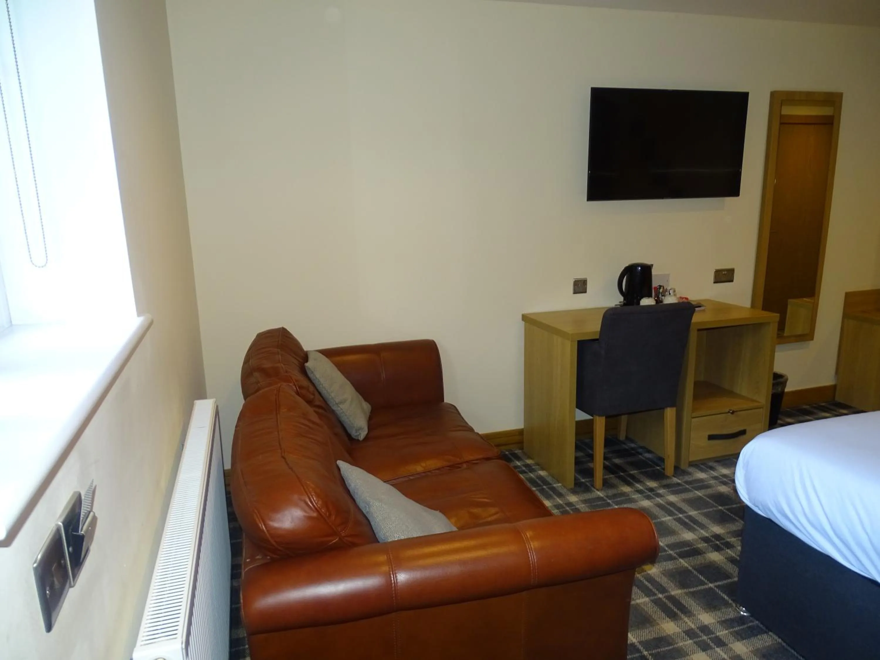 Seating area, Bed in Oddfellows Hotel