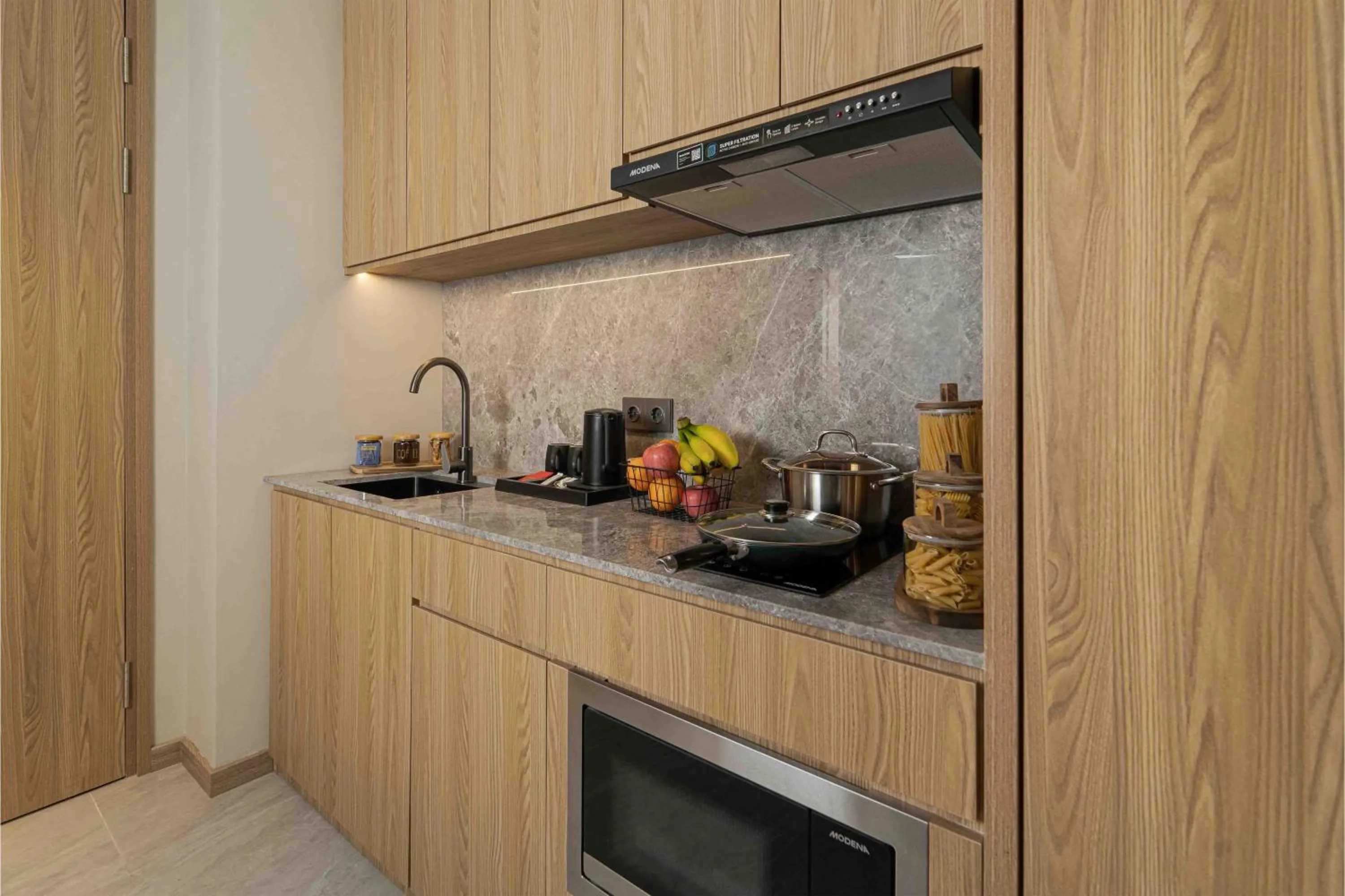 Kitchen or kitchenette in Oakwood Hotel & Apartments Grand Batam