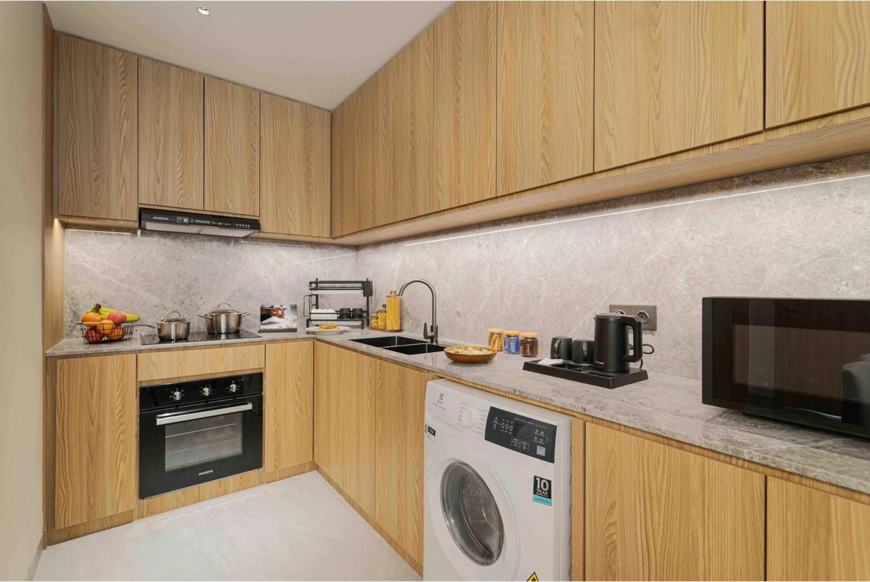 Kitchen or kitchenette in Oakwood Hotel & Apartments Grand Batam