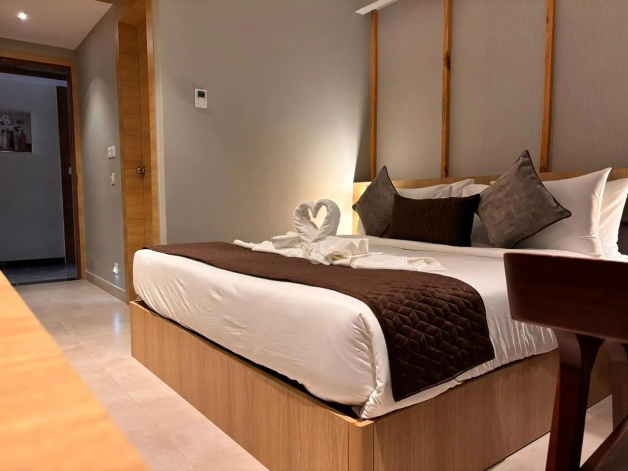 Photo of the whole room, Bed in NORTHIN Hotel Kolkata Airport