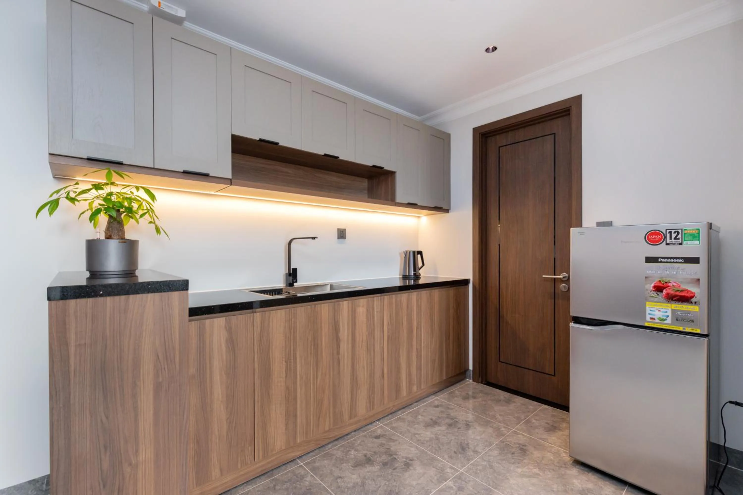 Kitchen or kitchenette in STELLA Hotel & Apartment