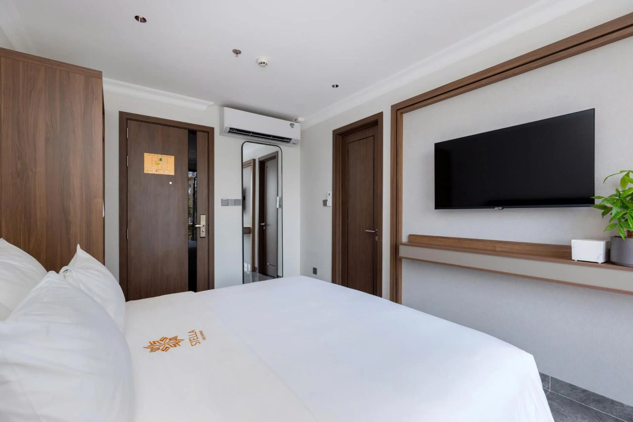 Bed in STELLA Hotel & Apartment