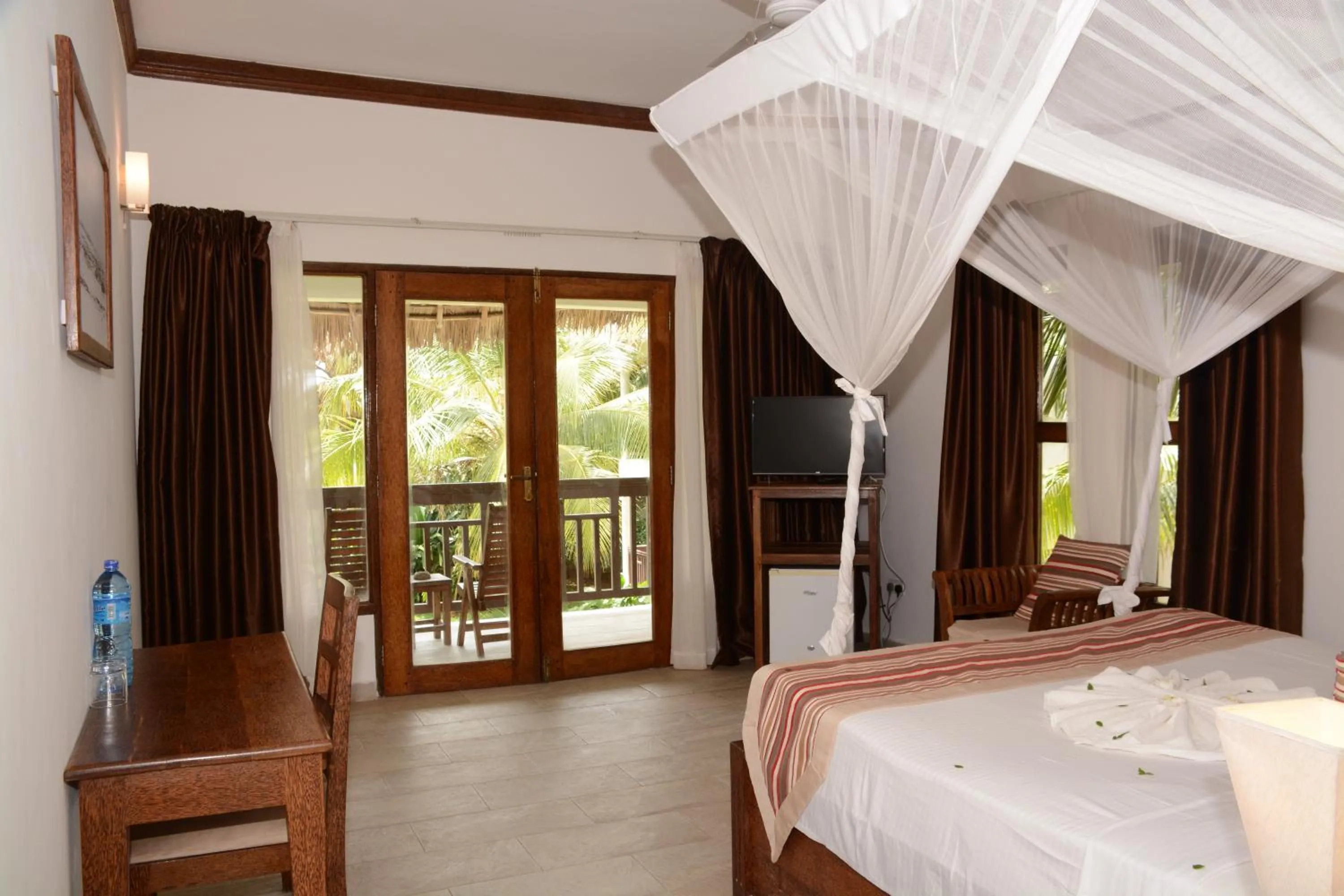Photo of the whole room, Bed in Zanzibar Bahari Villas