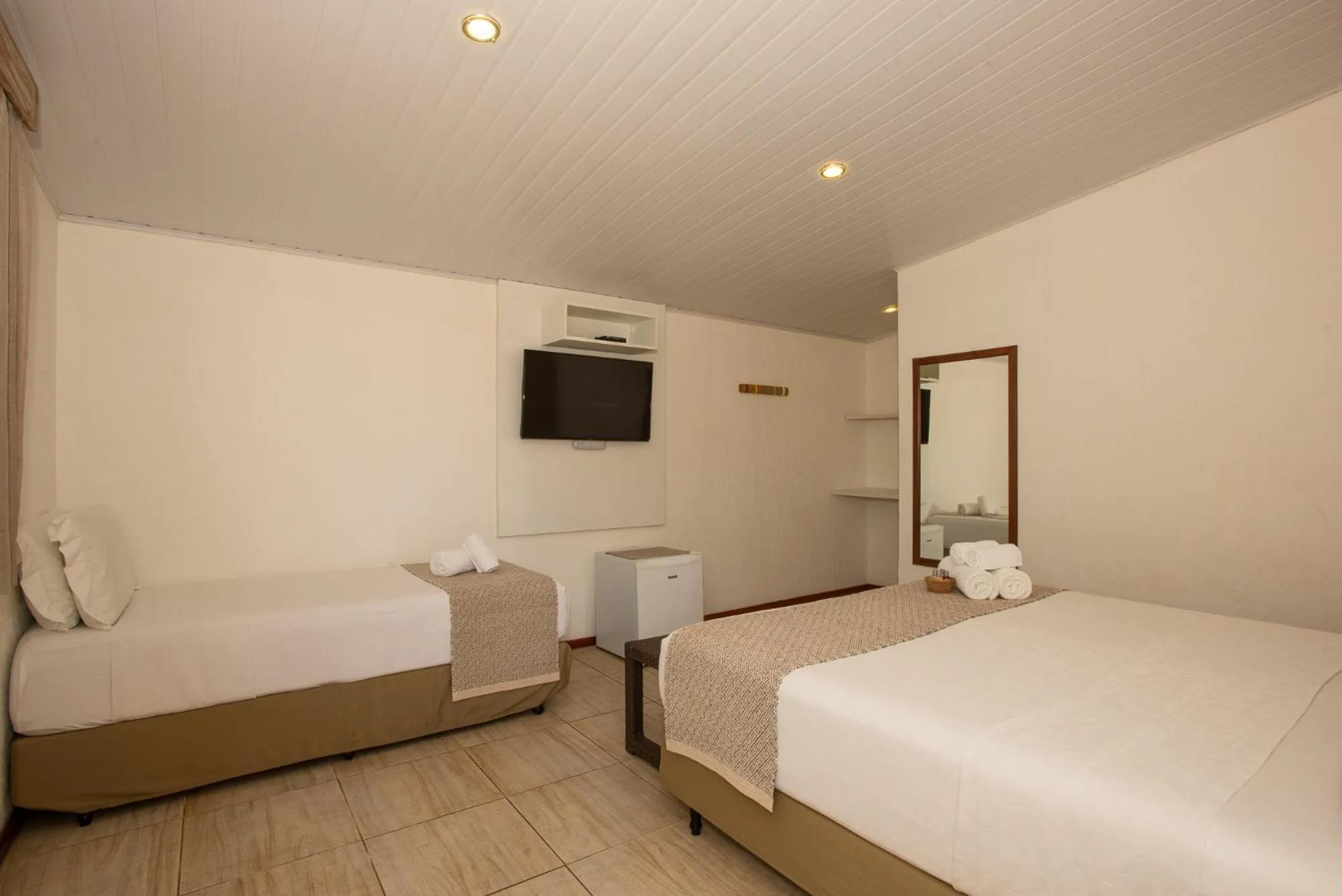 Bed in Pousada Malibu