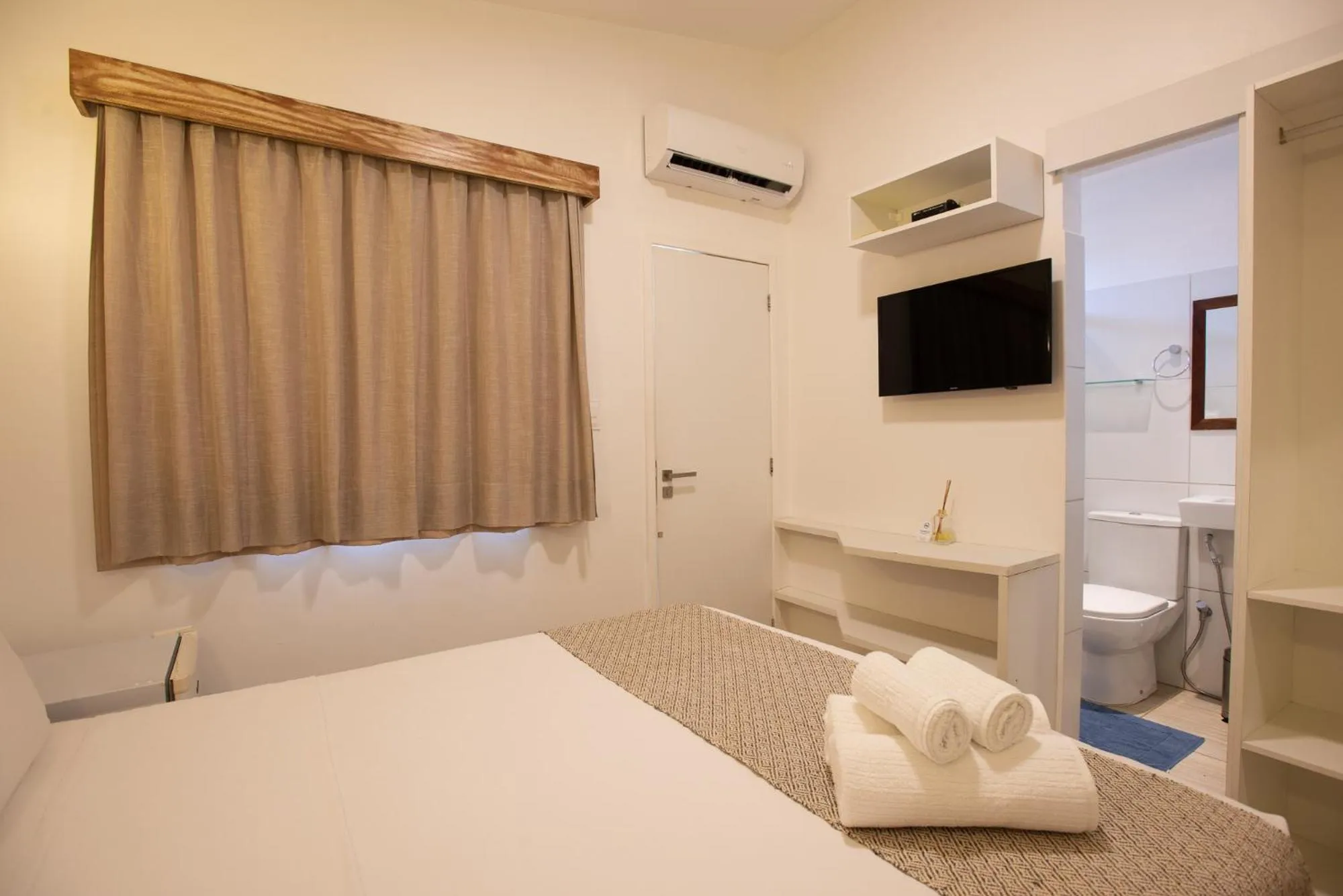 Bed in Pousada Malibu