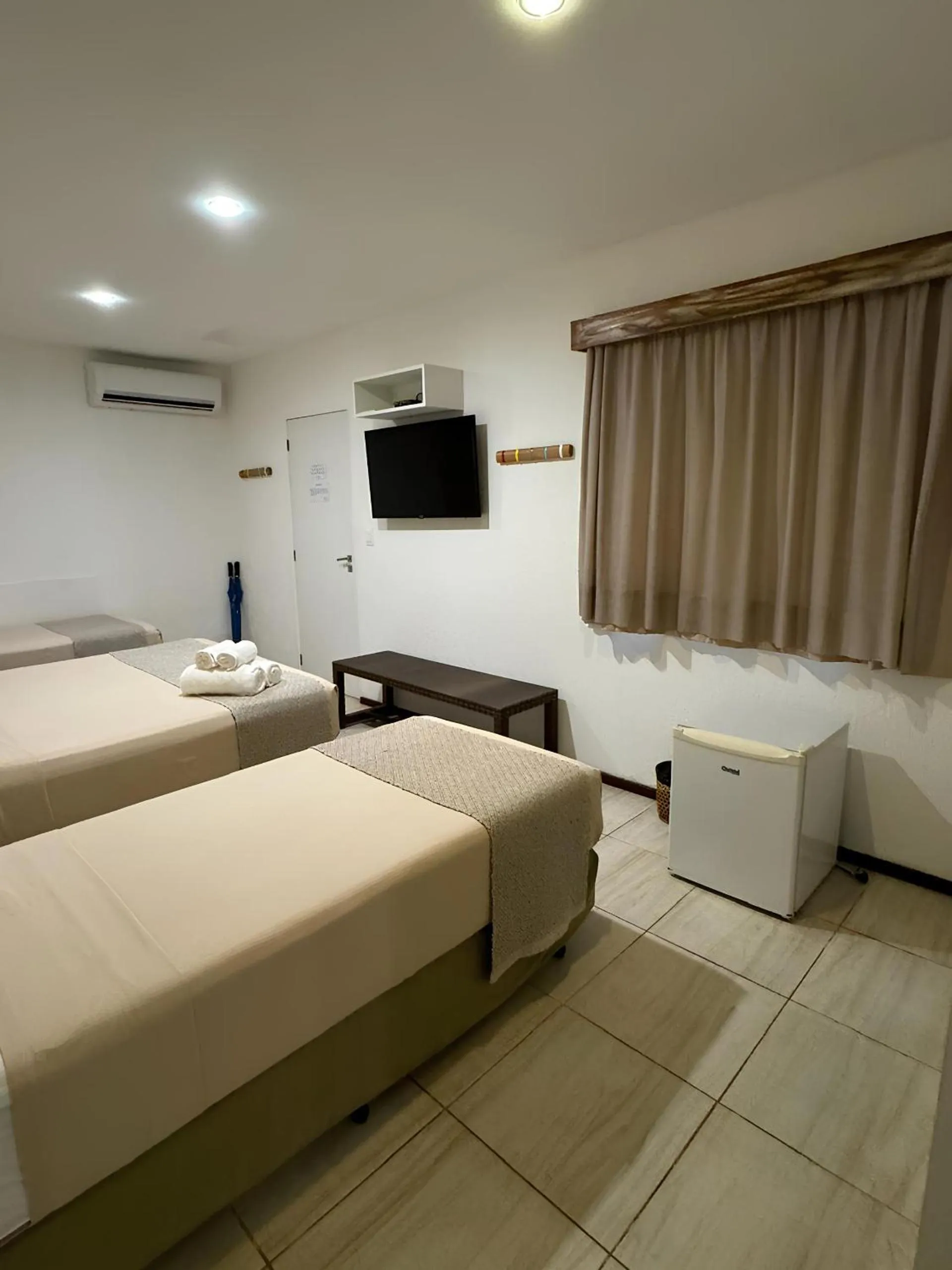 Photo of the whole room, Bed in Pousada Malibu