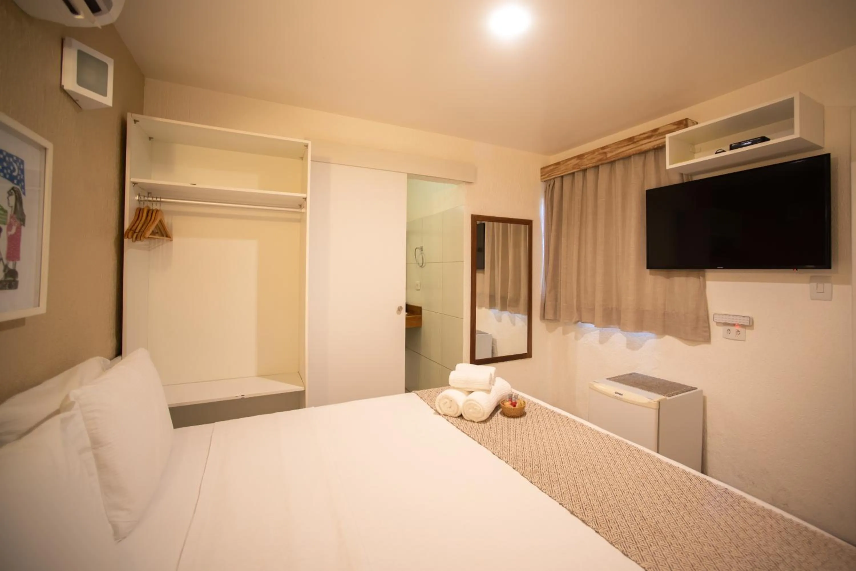 Bed in Pousada Malibu