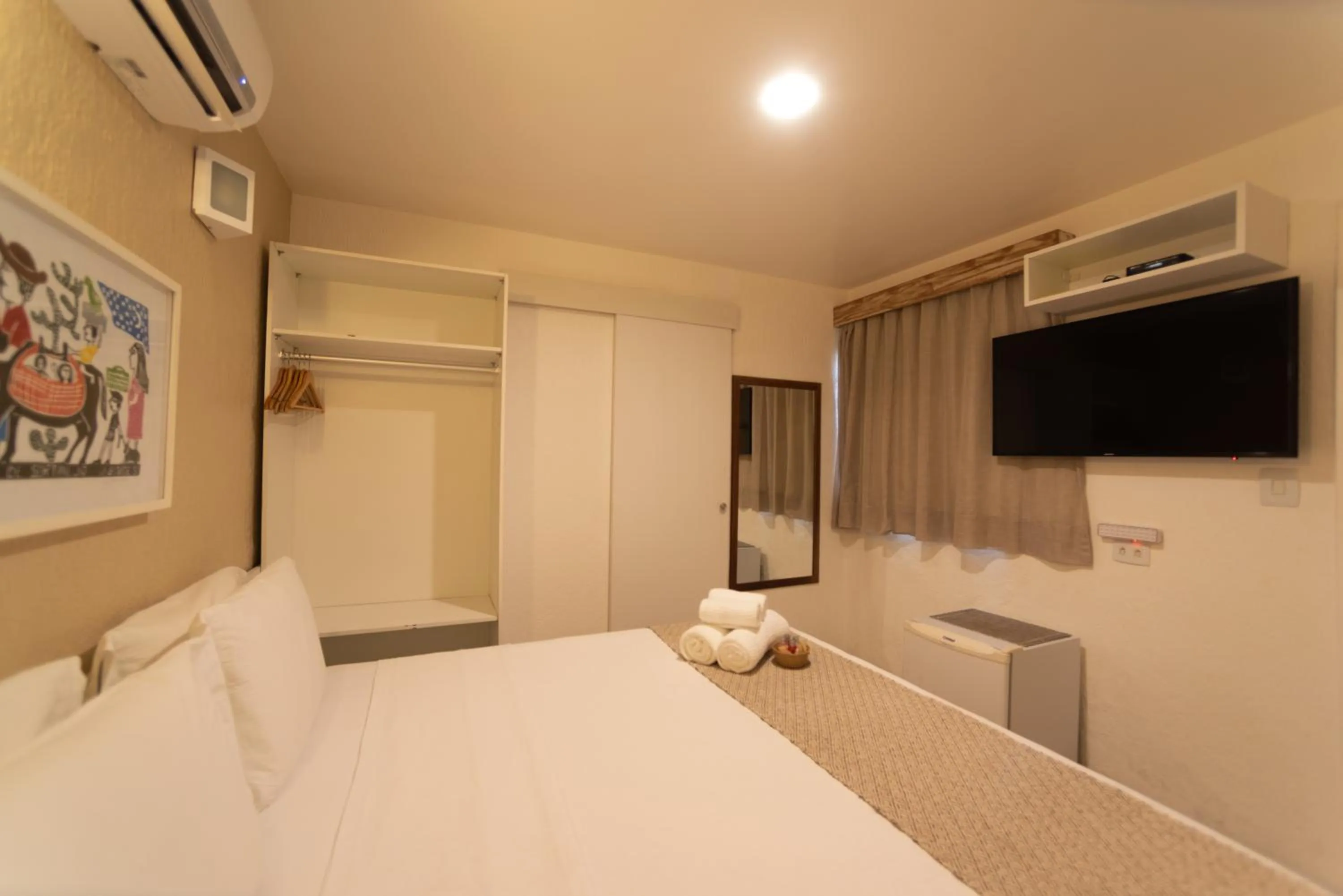 Bed in Pousada Malibu