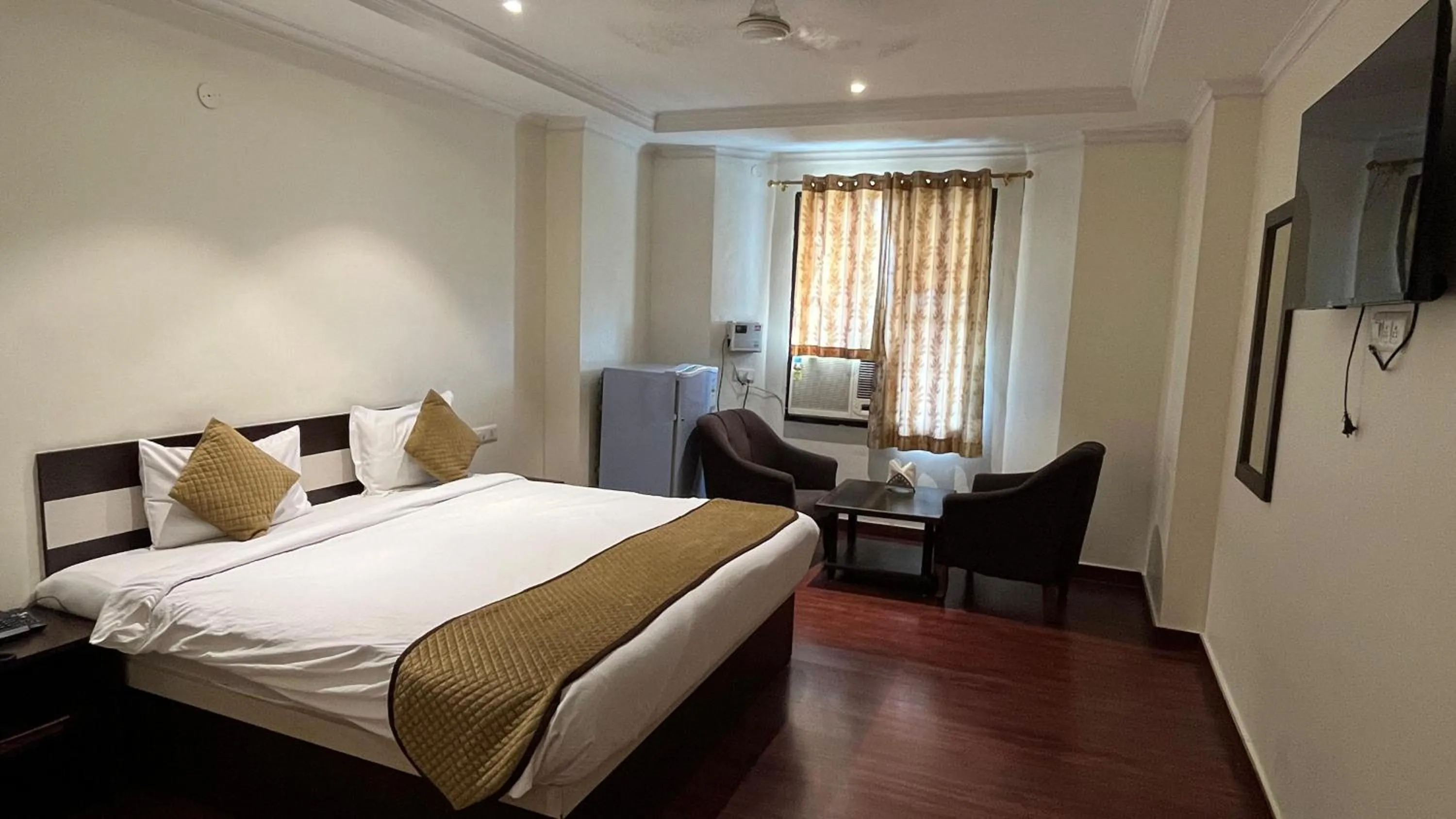 Bed in Hotel Vasu International