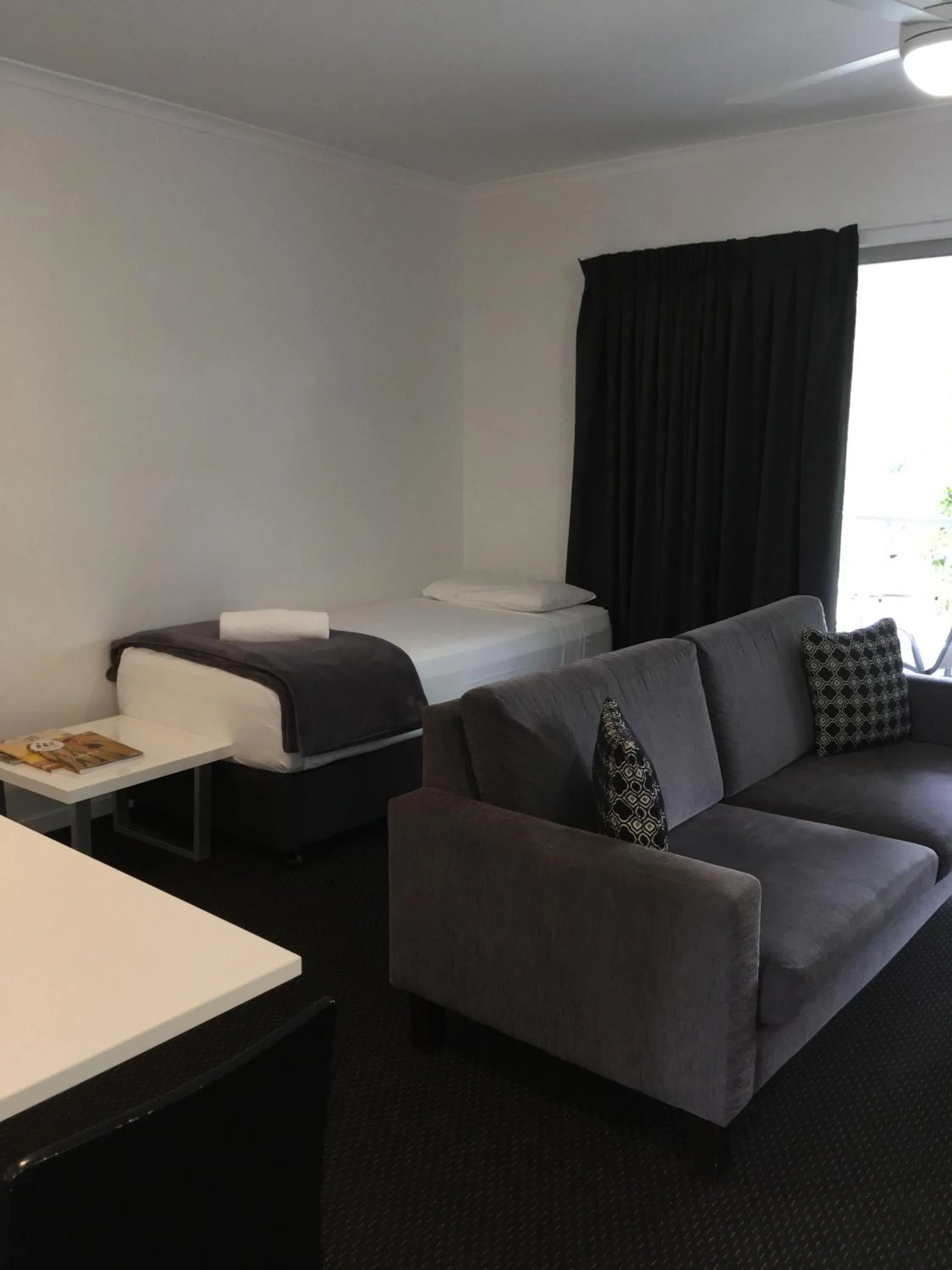 Bed in Cooroy Luxury Motel Apartments