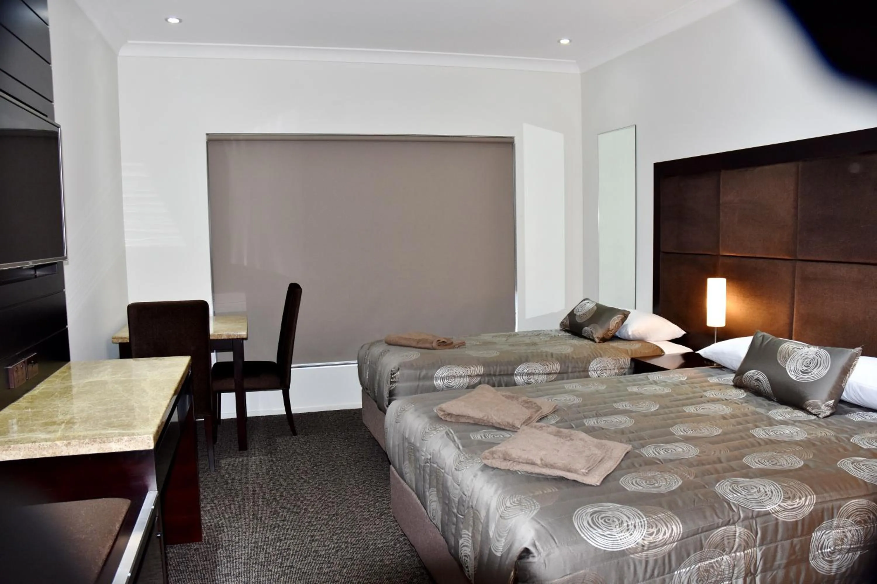 Bed in Western Downs Motor Inn