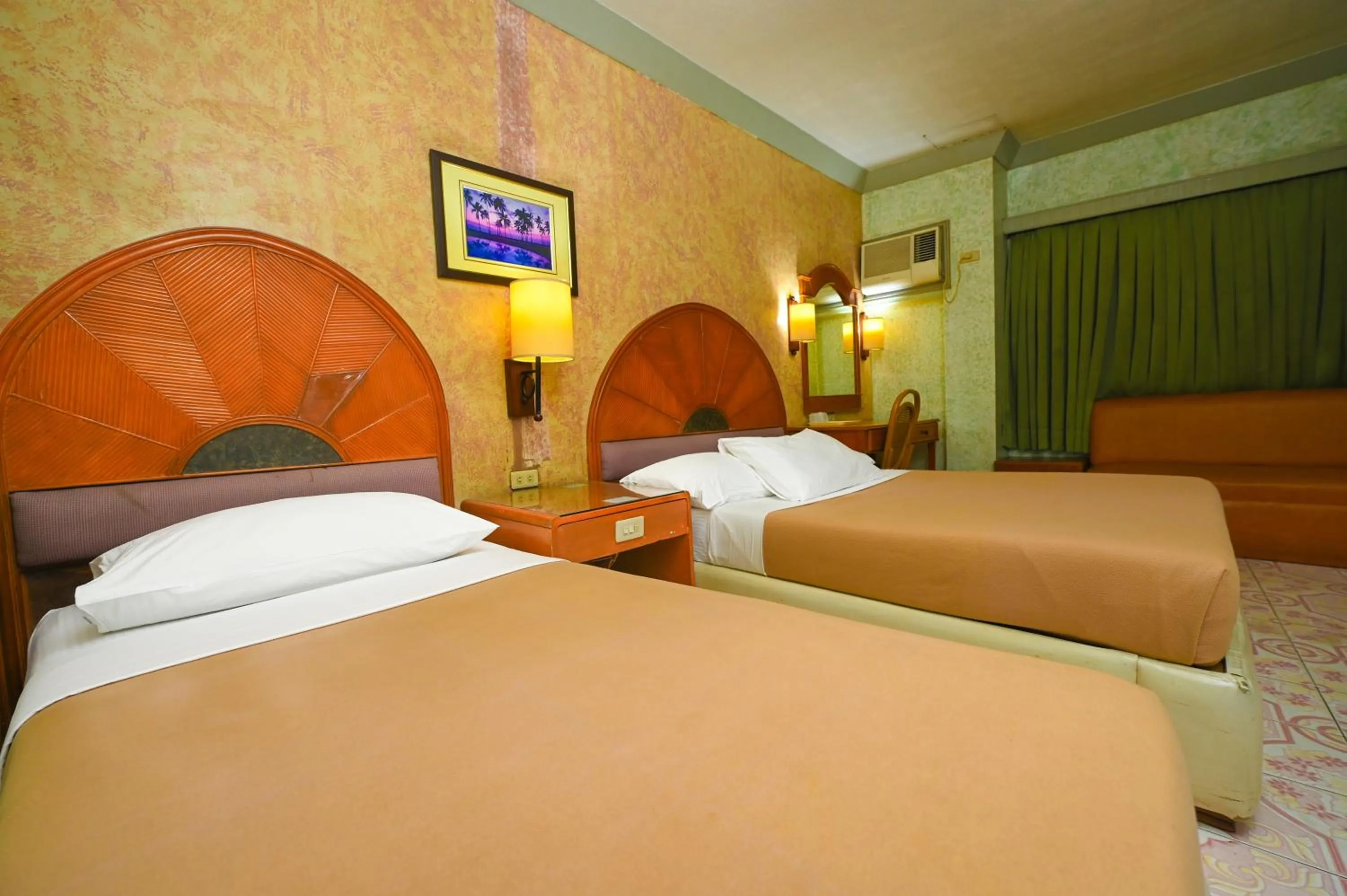 Bed in Grand City Hotel Inc.