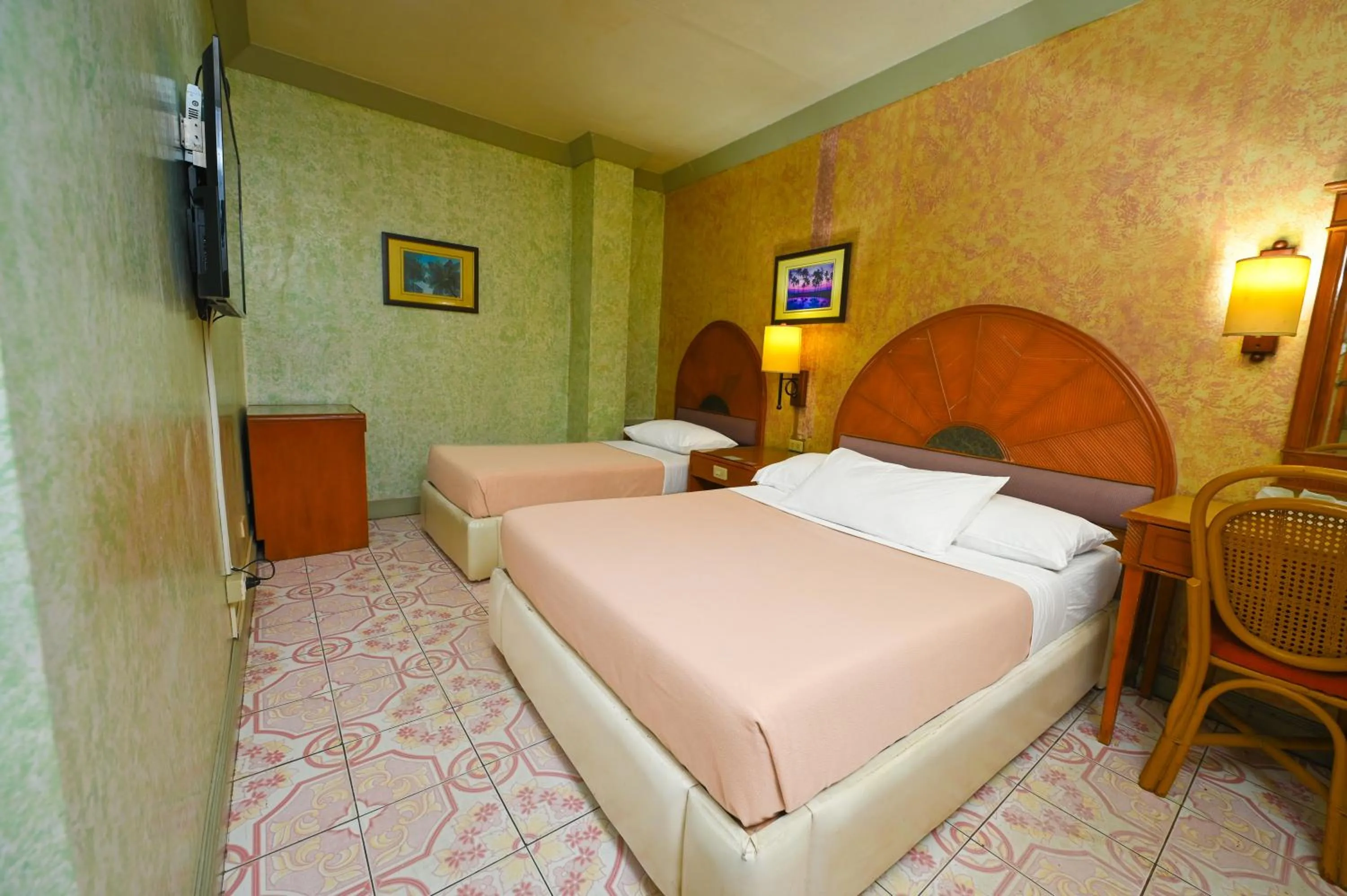 Bed in Grand City Hotel Inc.