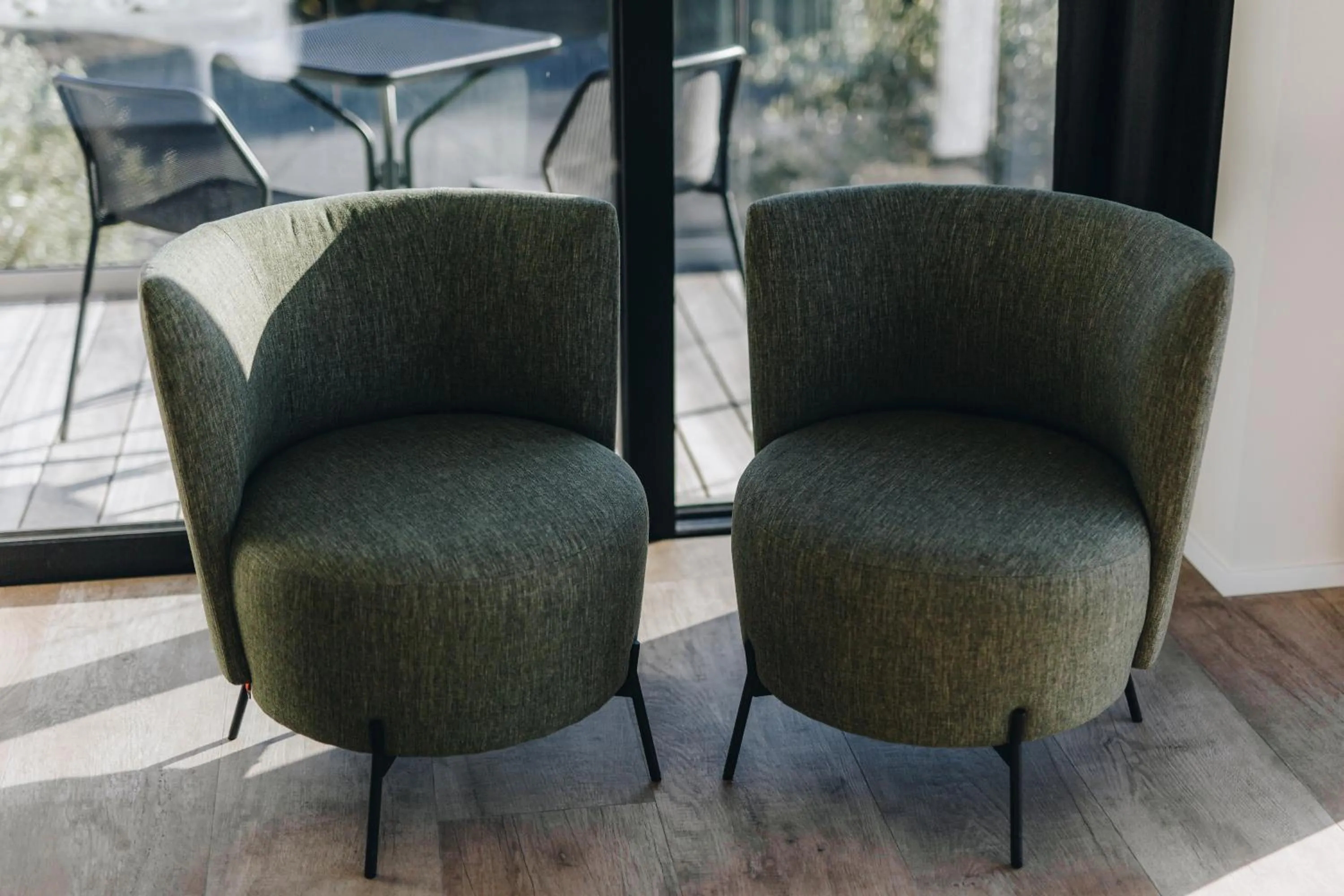 Seating area in CC Nomie Hôtel Restaurant