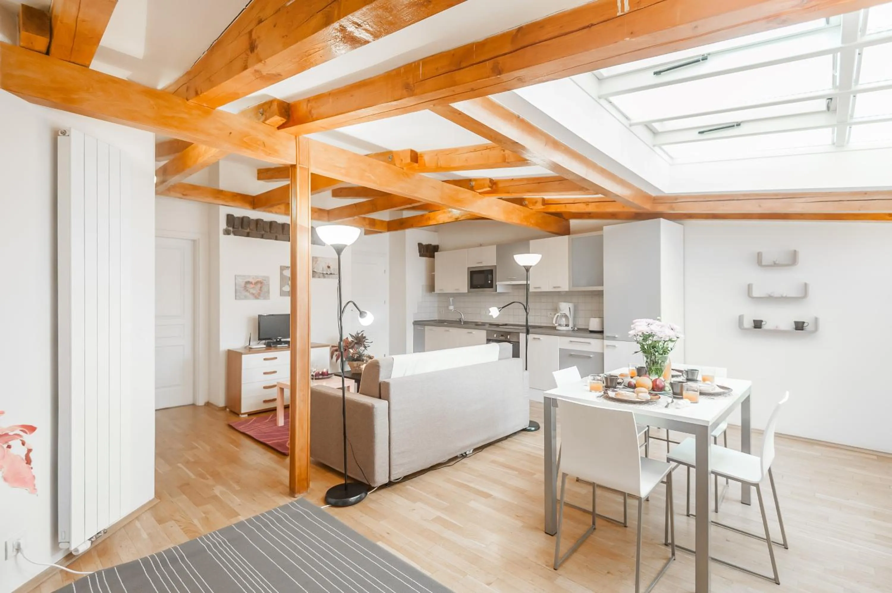 Dining area, Bed in Hybernska Apartments by Pragueforyou