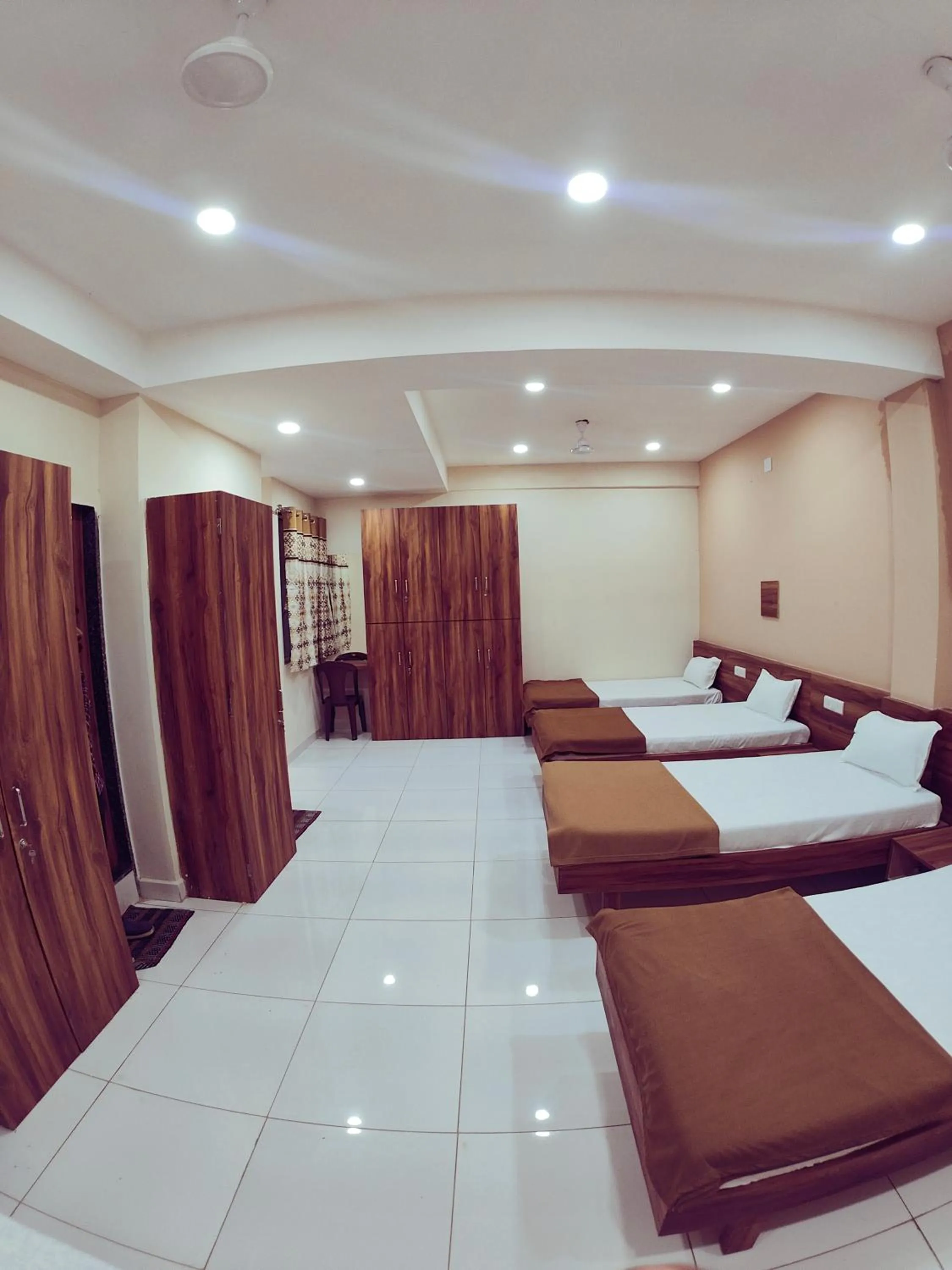 Living room, Bed in Hotel Samruddhi Residency