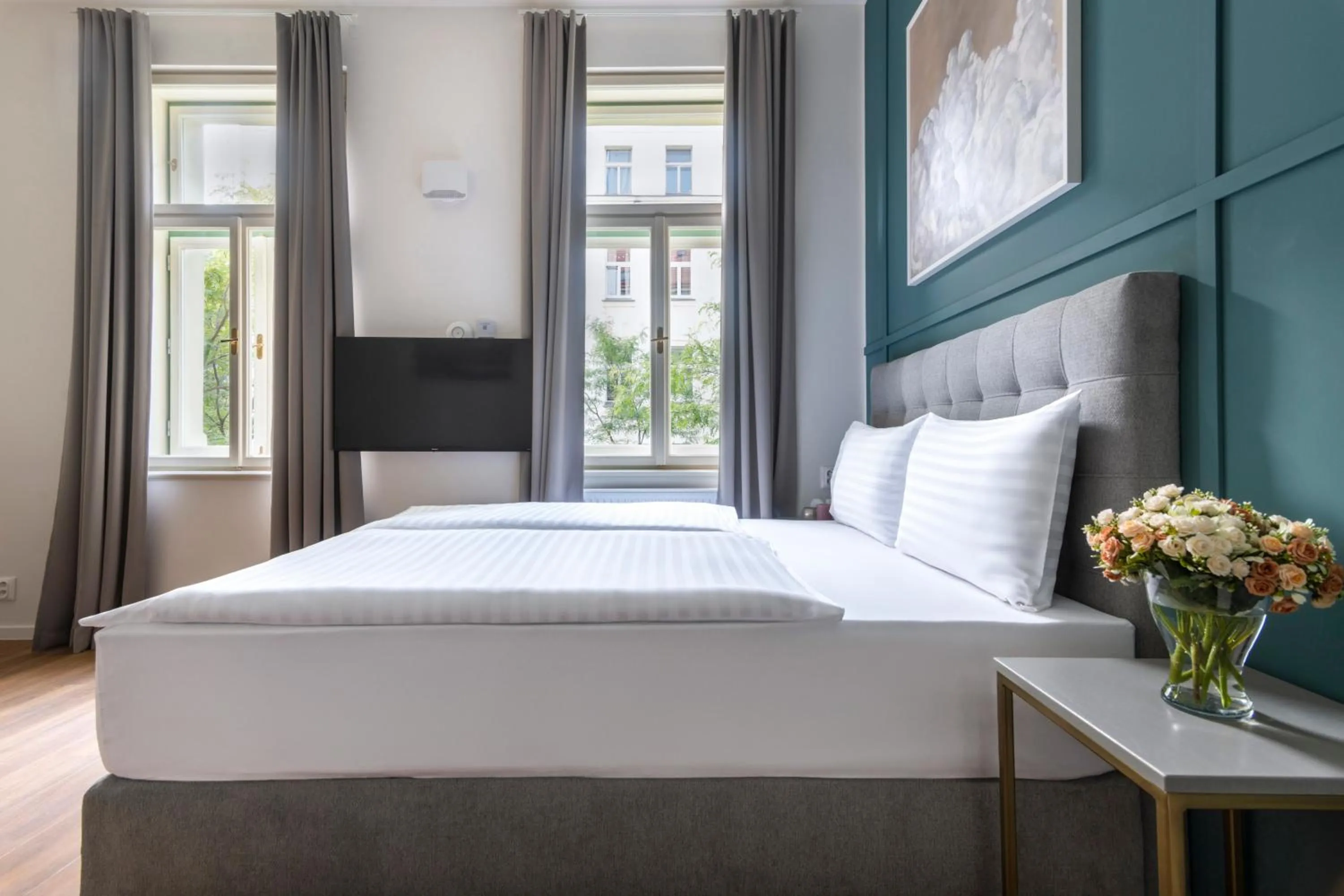 Bed in Encore Boutique Residence by Dwellfort