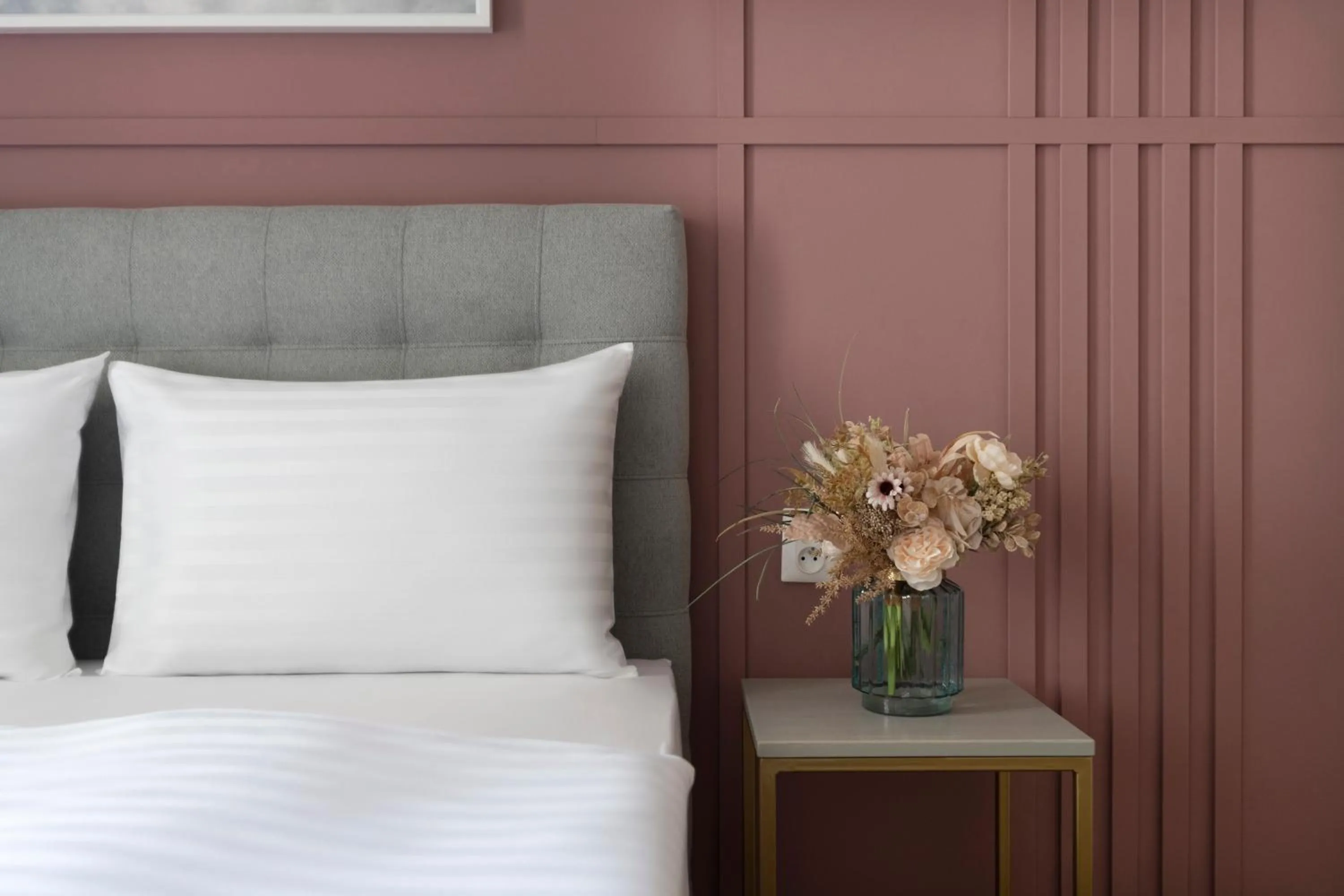 Bed in Encore Boutique Residence by Dwellfort